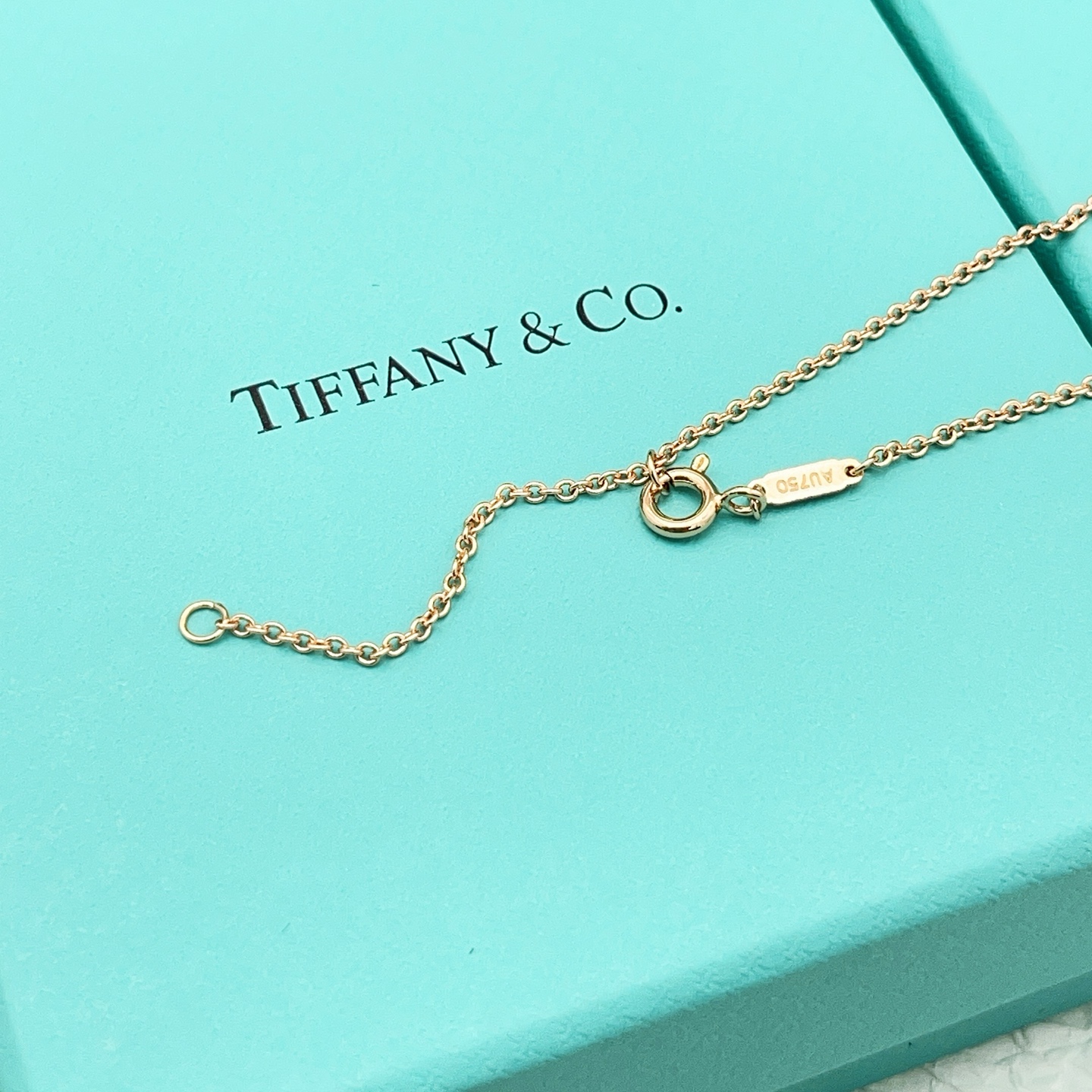 Tiffany Co Knot necklace 18k rose gold with clear diamonds 16 inches