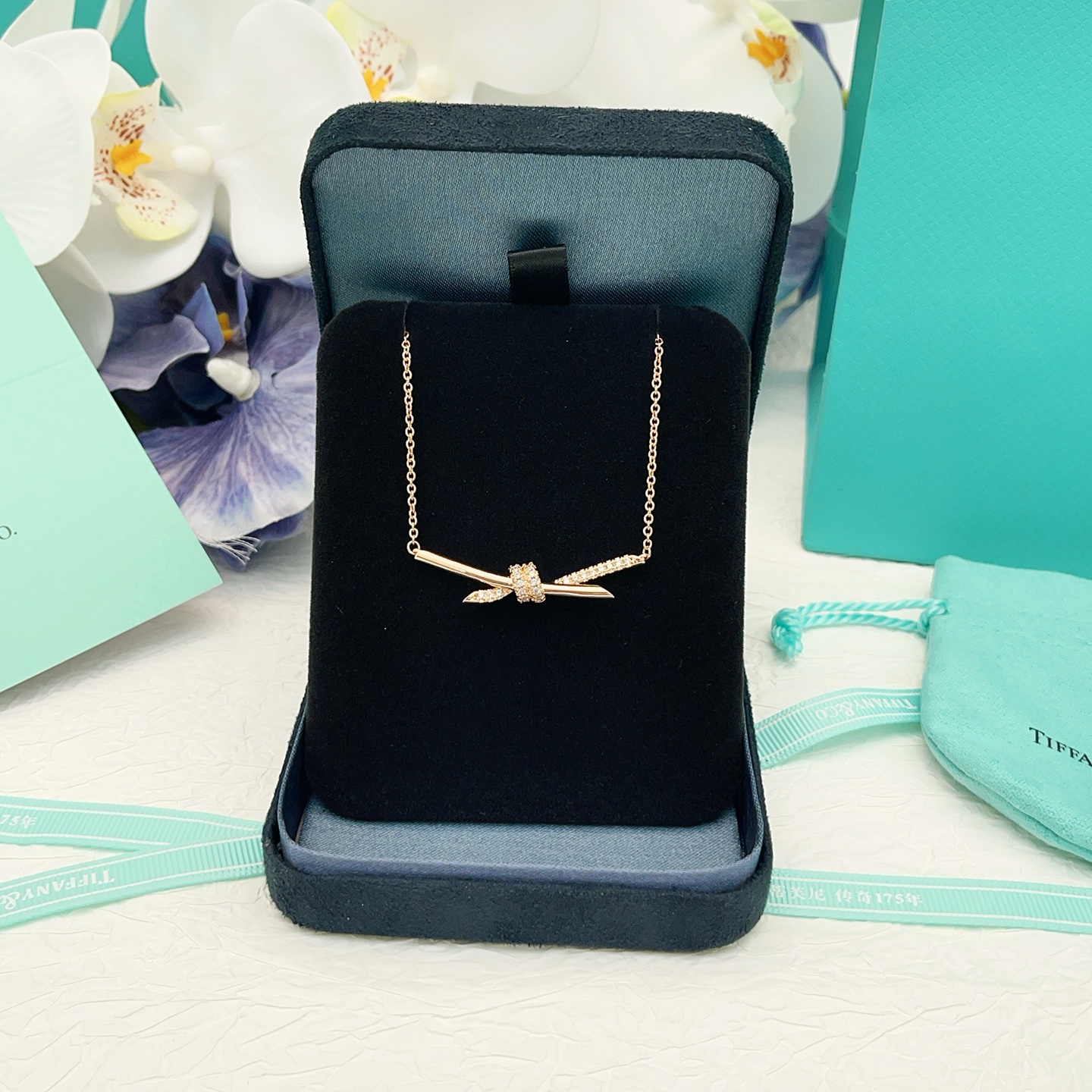 Tiffany Co Knot necklace 18k rose gold with clear diamonds 16 inches