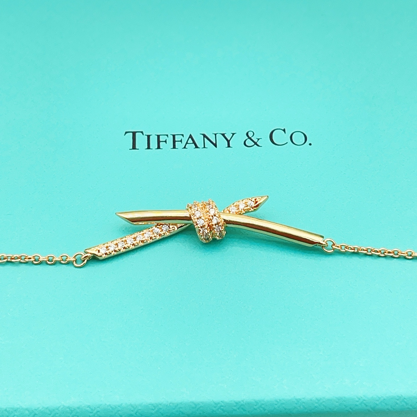 Tiffany Co Knot necklace 18k rose gold with clear diamonds 16 inches