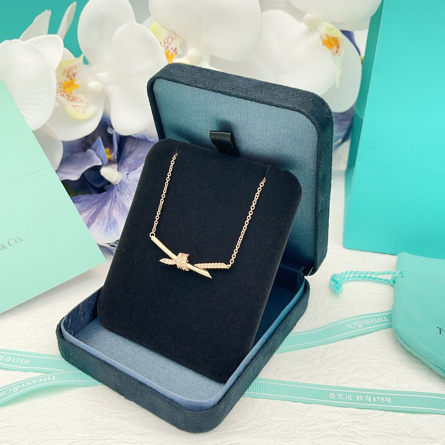 Tiffany Co Knot necklace 18k rose gold with clear diamonds 16 inches