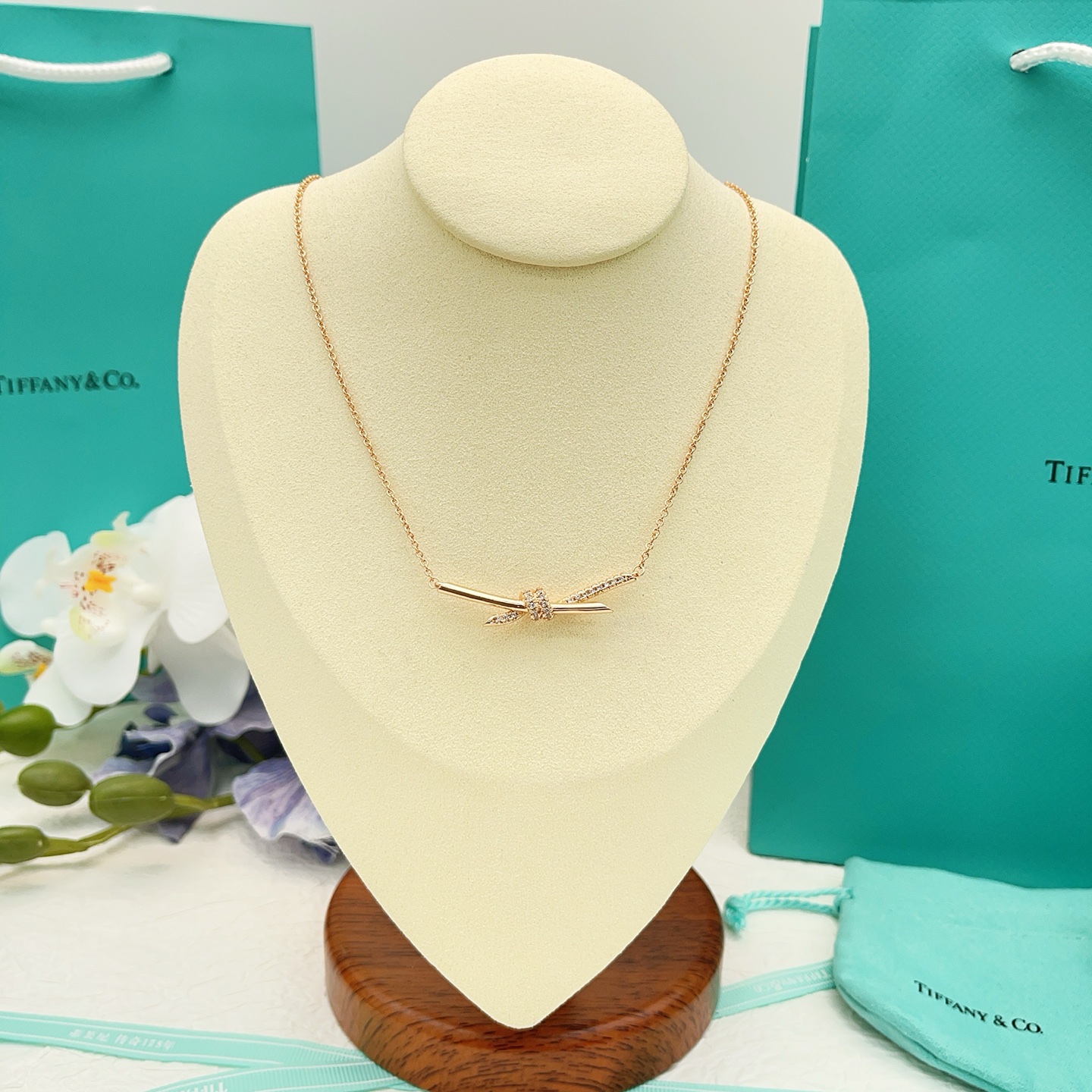 Tiffany Co Knot necklace 18k rose gold with clear diamonds 16 inches