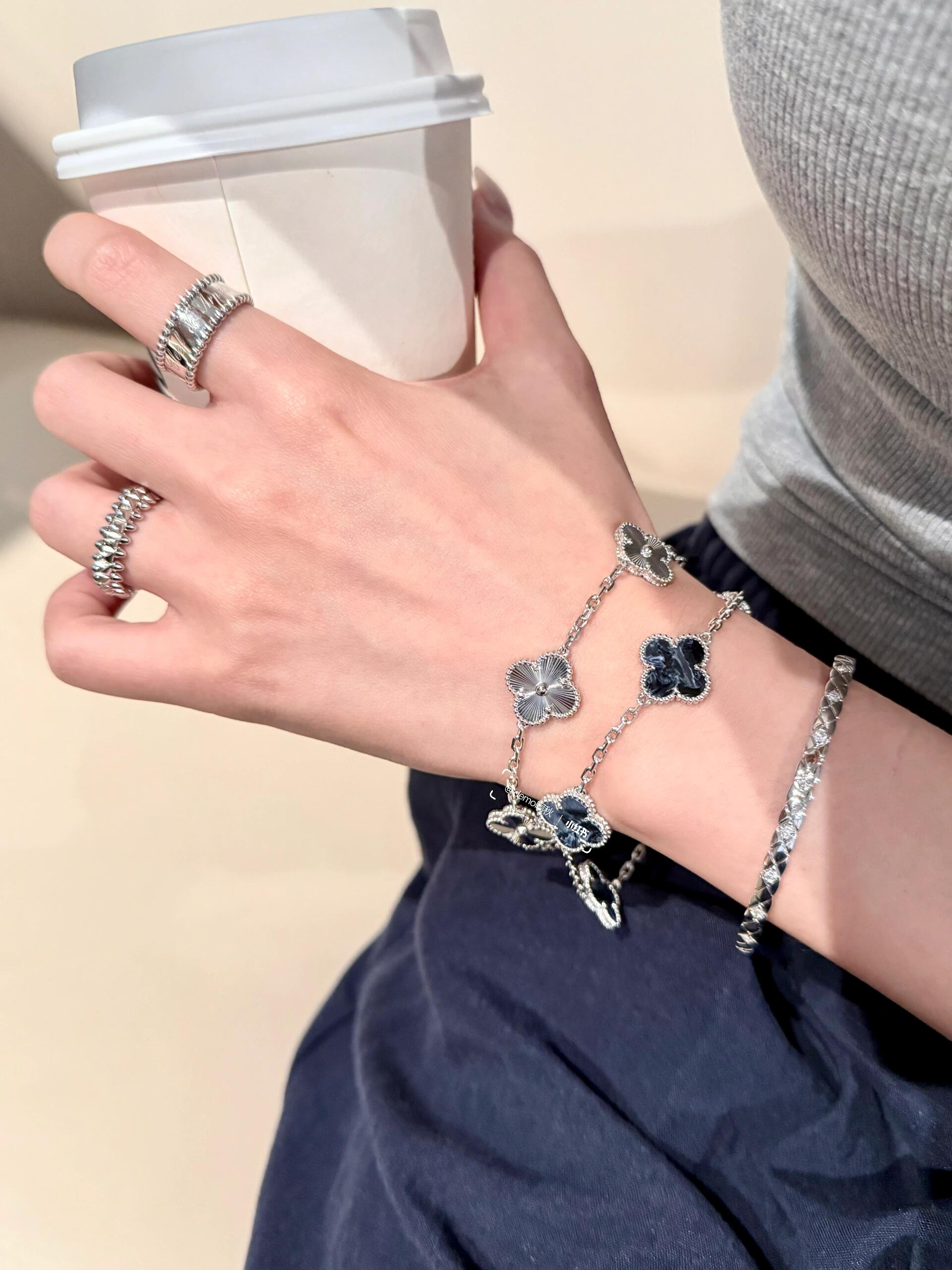 Van Cleef Arpels Alhambra bracelet silver-toned metal with dark blue pietersite clover motifs 18cm