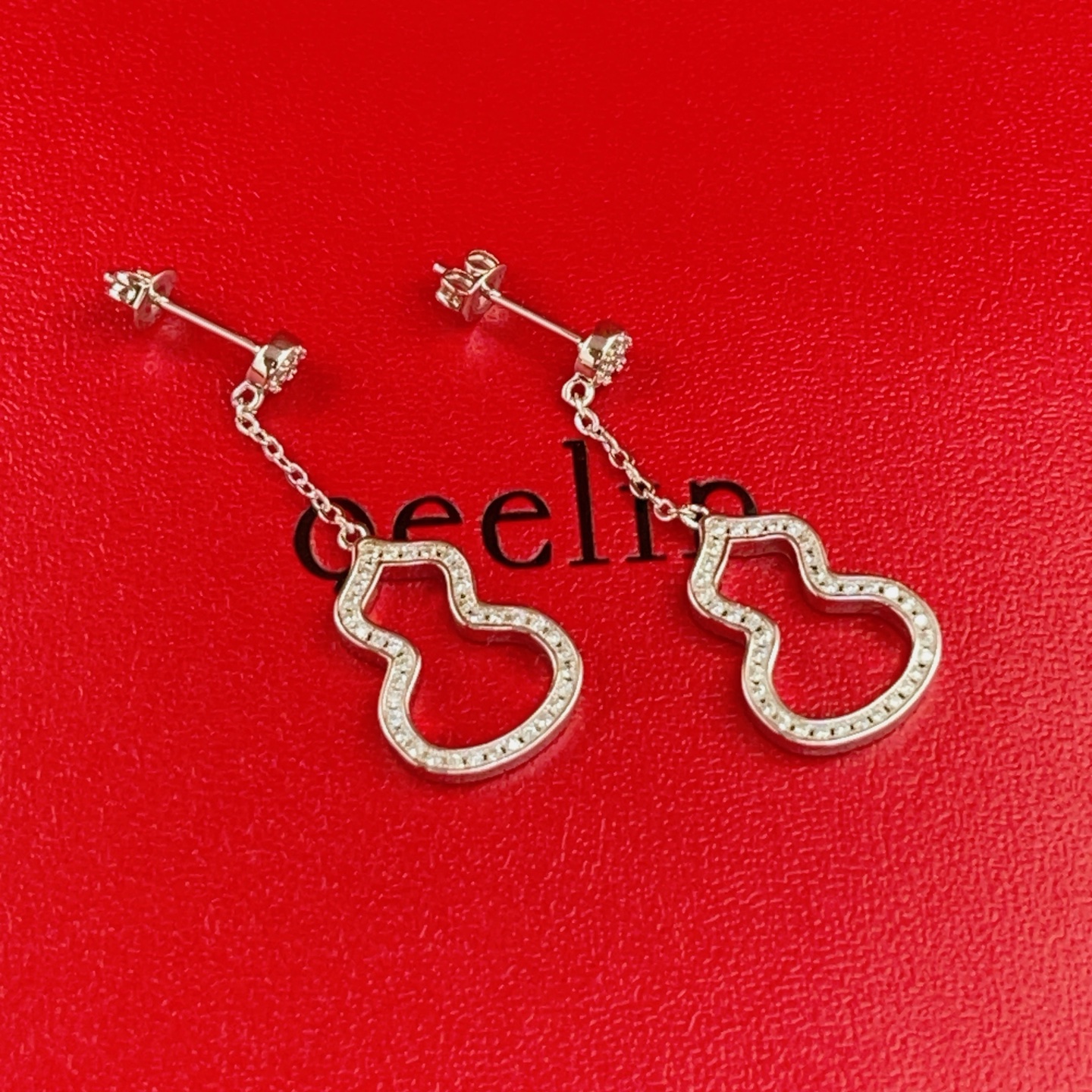 Qeelin Wulu earrings silver-toned white gold with clear diamond accents 2 5cm drop length
