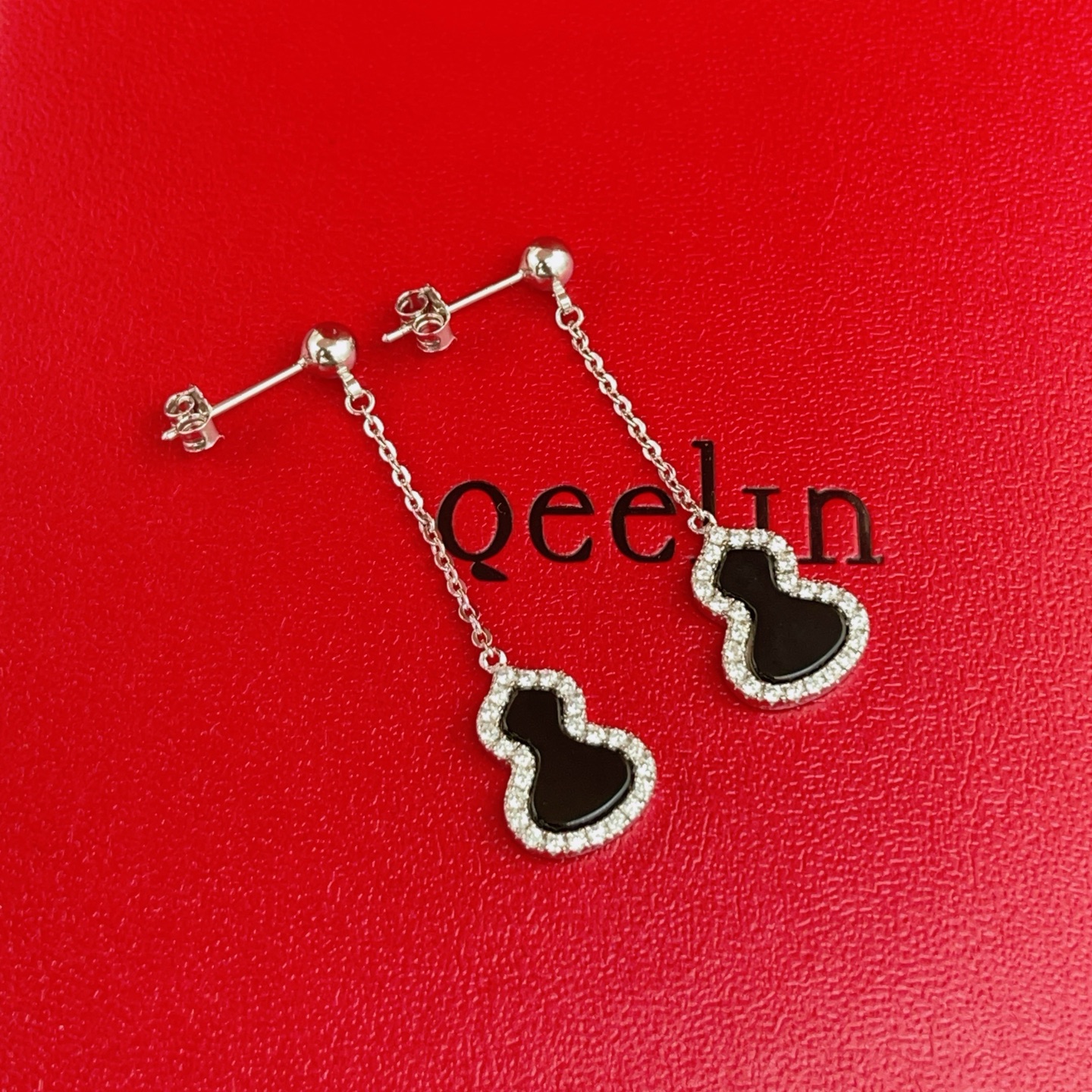 Qeelin Wulu earrings silver-toned white gold with black onyx and clear diamond accents 3cm drop length