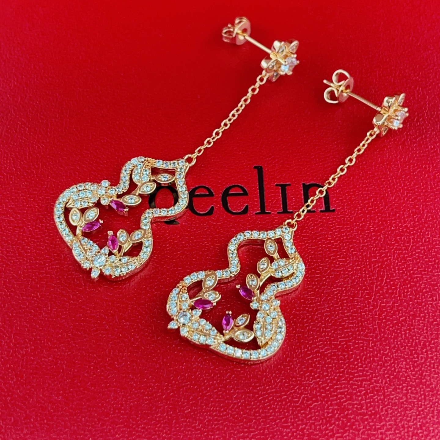Qeelin Wulu Garden earrings rose gold metal with clear diamonds and ruby red gemstones 4 5cm drop length