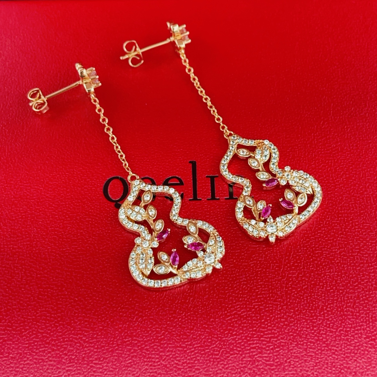 Qeelin Wulu Garden earrings rose gold metal with clear diamonds and ruby red gemstones 4 5cm drop length