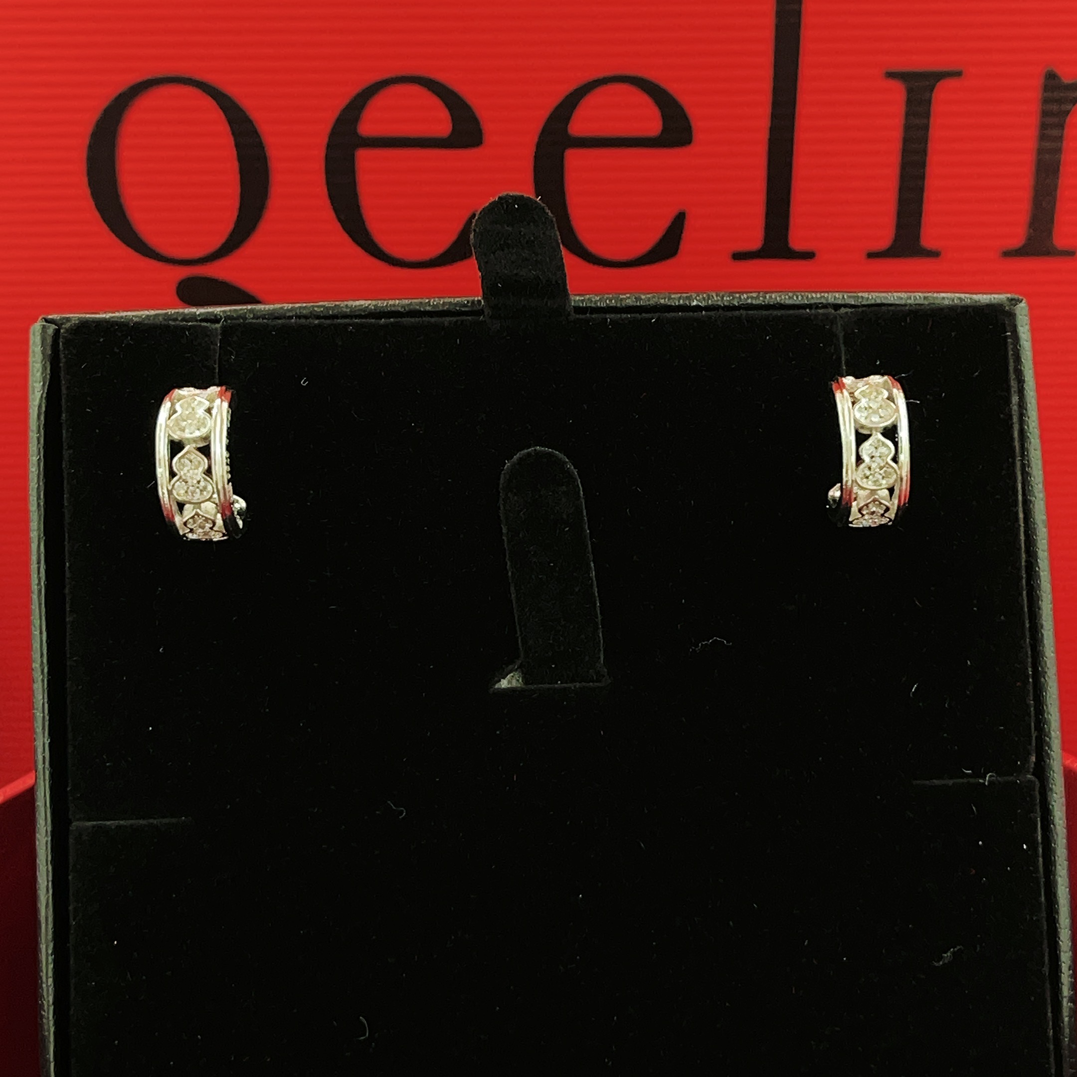 Qeelin Wulu earrings 18K white gold with clear diamond accents 10mm outer diameter