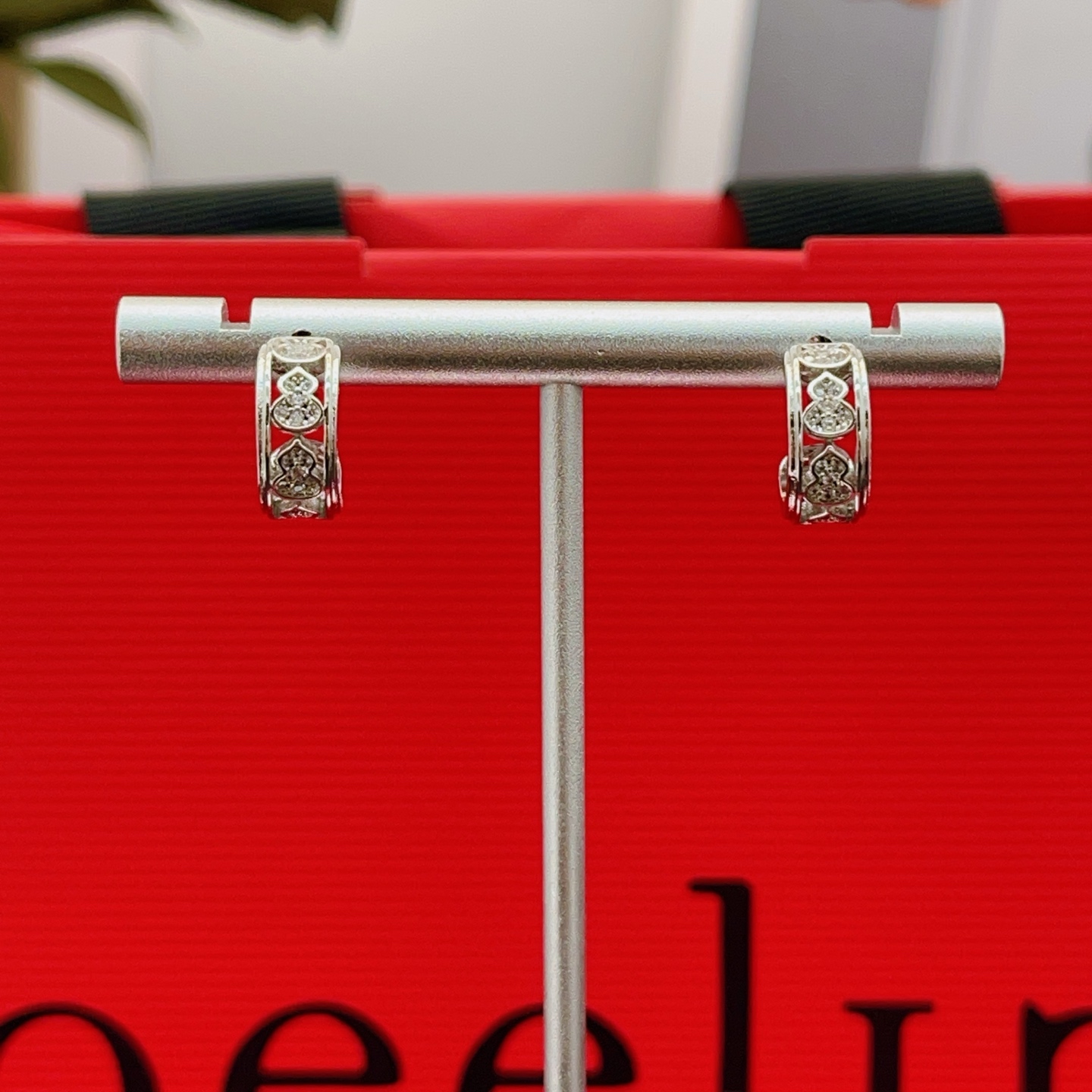Qeelin Wulu earrings 18K white gold with clear diamond accents 10mm outer diameter