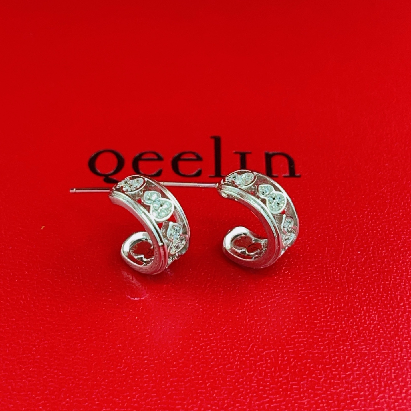 Qeelin Wulu earrings 18K white gold with clear diamond accents 10mm outer diameter