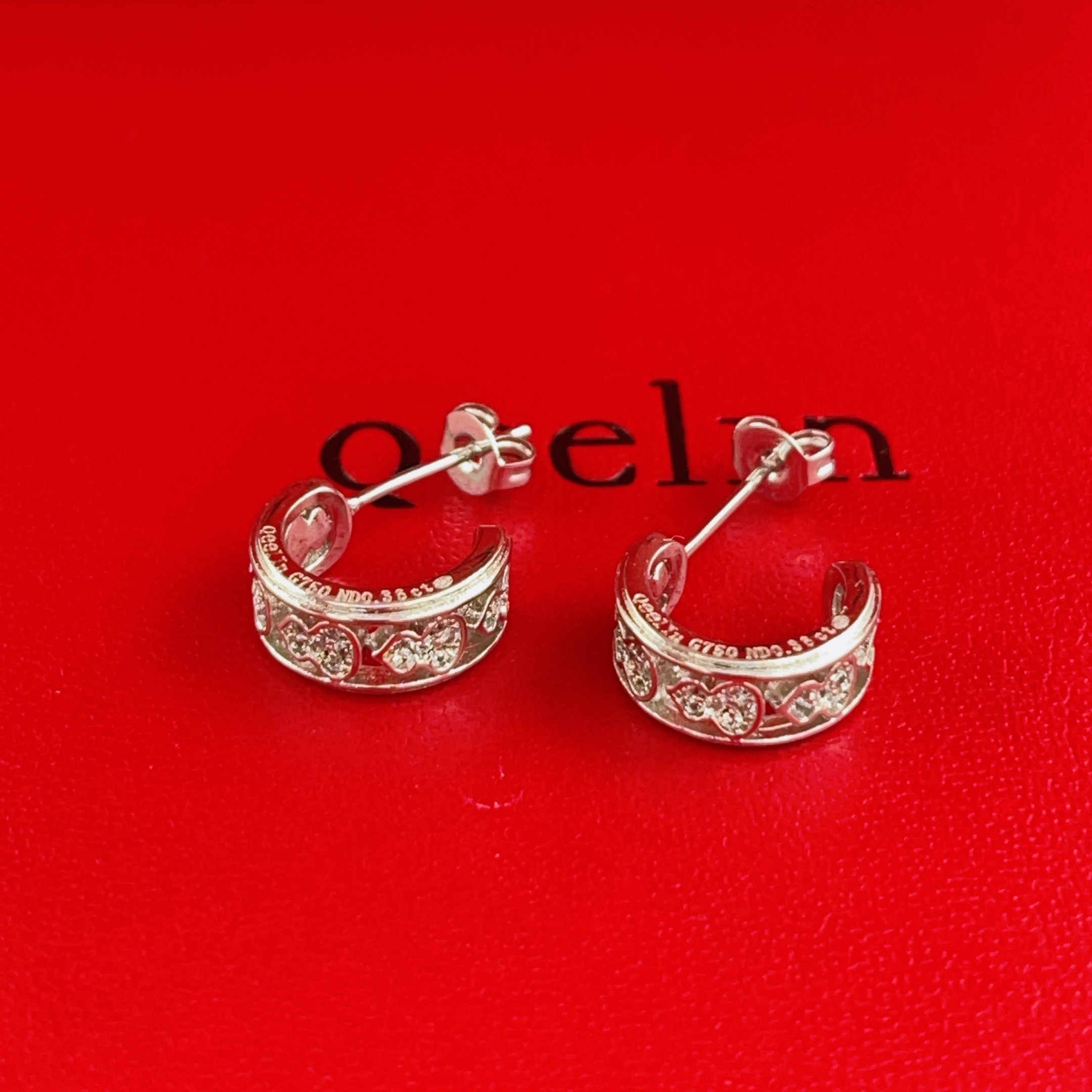 Qeelin Wulu earrings 18K white gold with clear diamond accents 10mm outer diameter