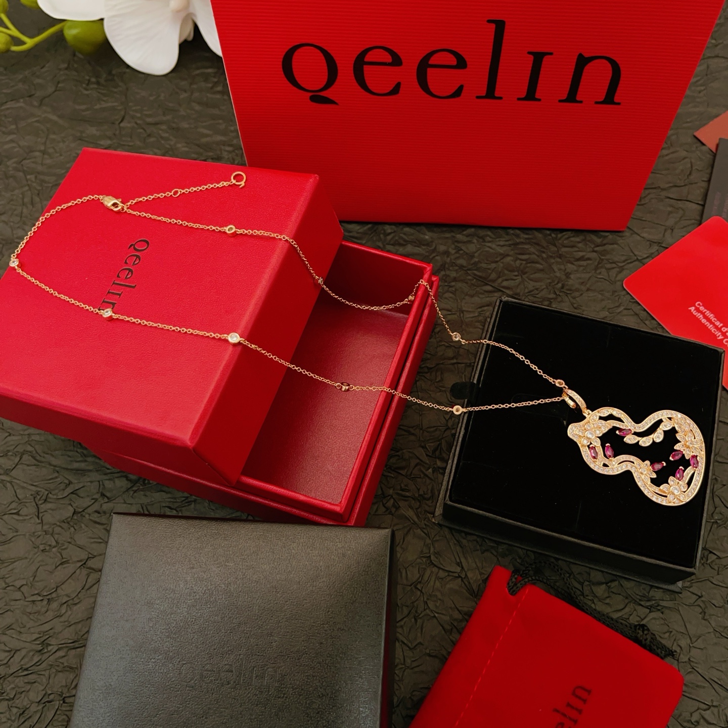 Qeelin Wulu necklace Rose gold metal with clear diamonds and ruby red gemstones 45cm