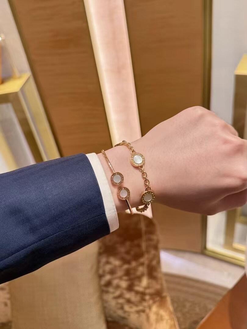 Bvlgari Bvlgari Bvlgari Open Cuff Bangle bracelet Available in rose gold yellow gold silver metal options with white mother-of-pearl or black onyx stone inlays 17cm