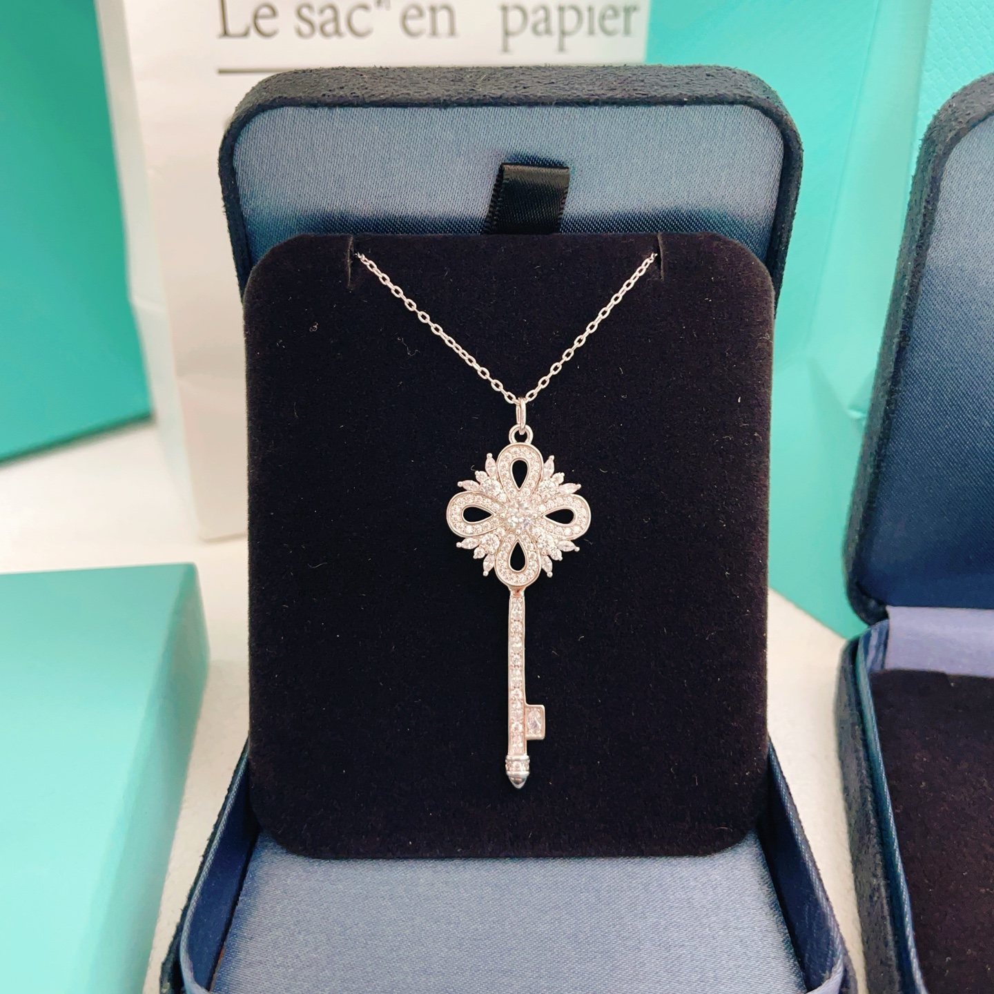 Tiffany Co Tiffany Keys Victoria Key Pendant necklace sterling silver with clear diamond-like gemstones 18 inch adjustable chain