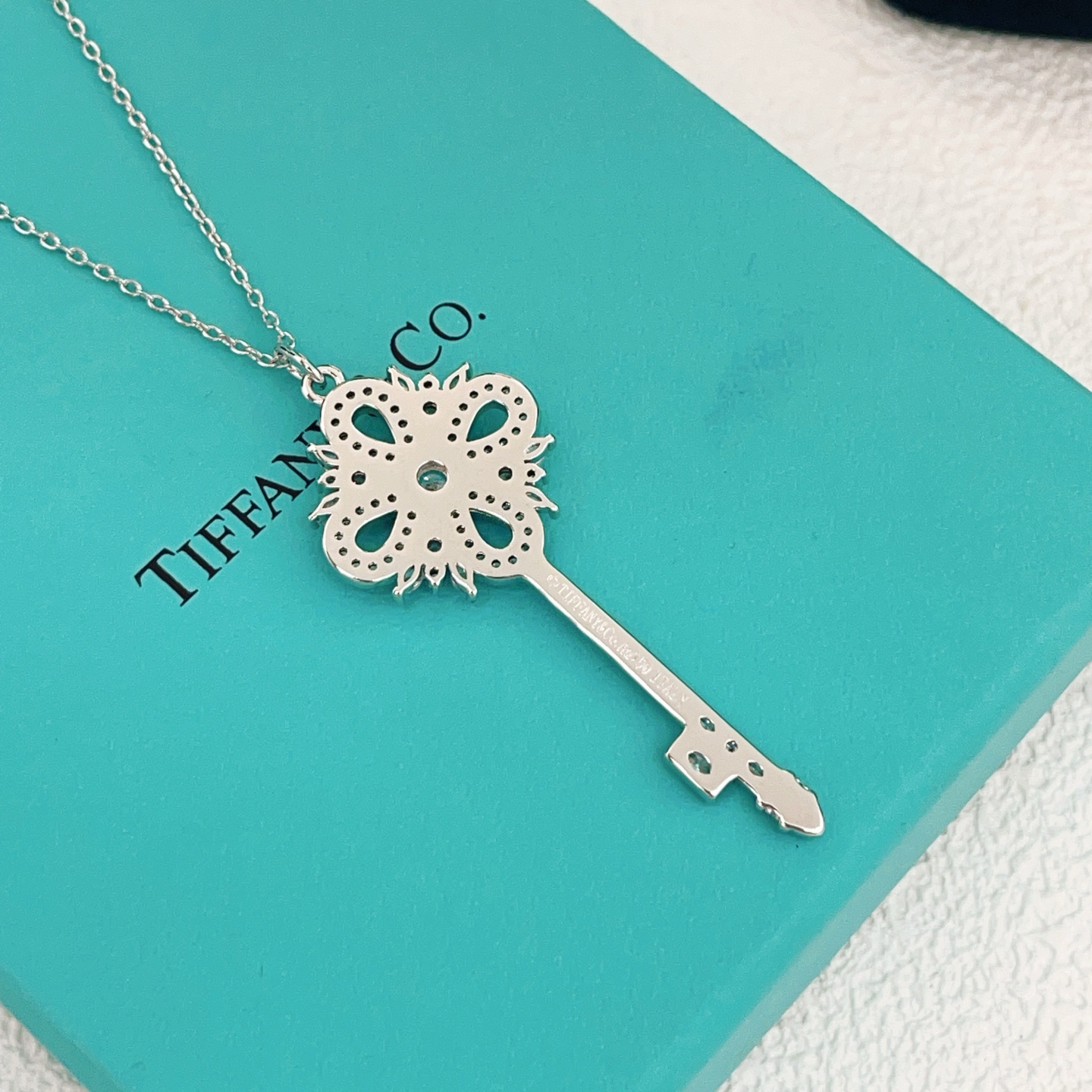 Tiffany Co Tiffany Keys Victoria Key Pendant necklace sterling silver with clear diamond-like gemstones 18 inch adjustable chain