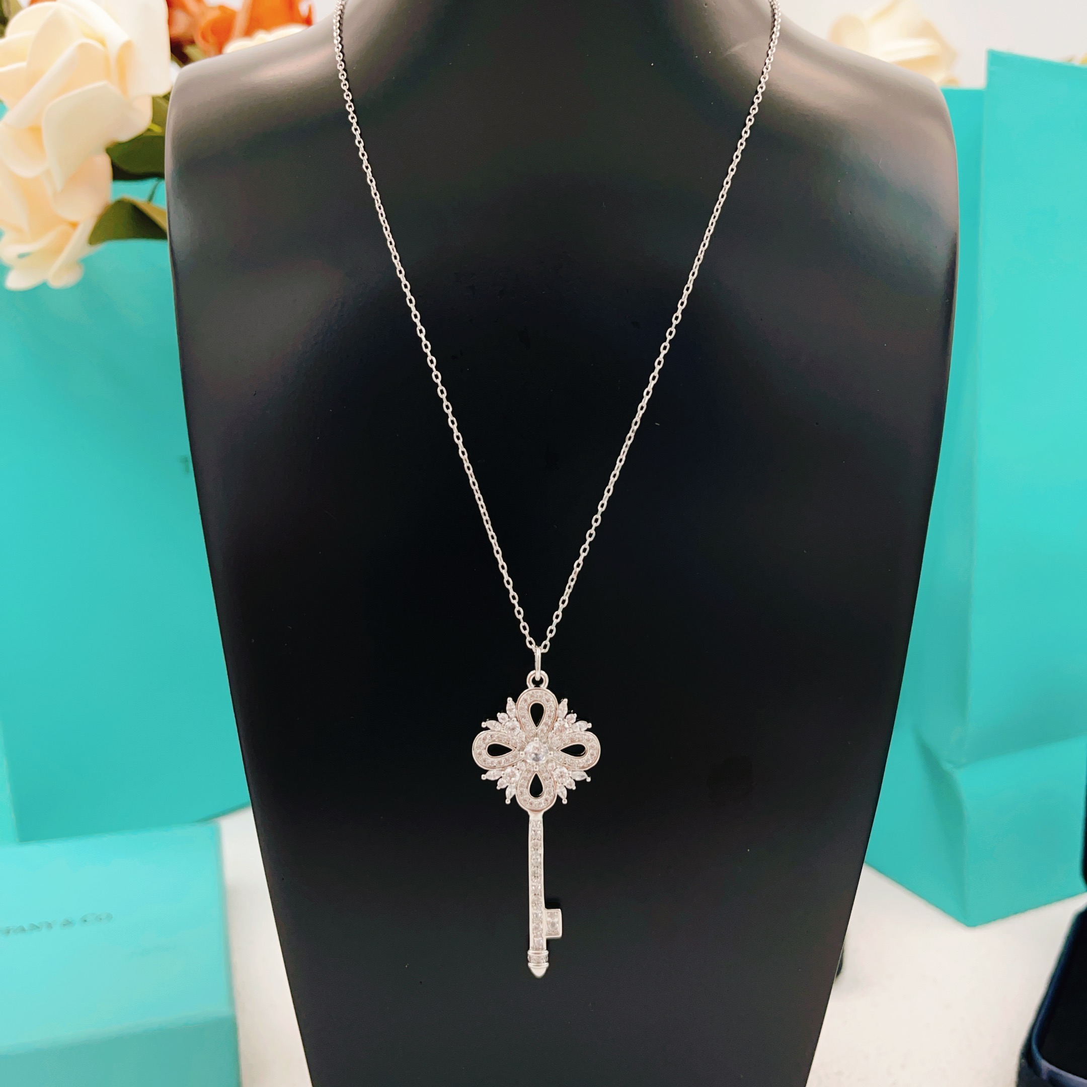 Tiffany Co Tiffany Keys Victoria Key Pendant necklace sterling silver with clear diamond-like gemstones 18 inch adjustable chain