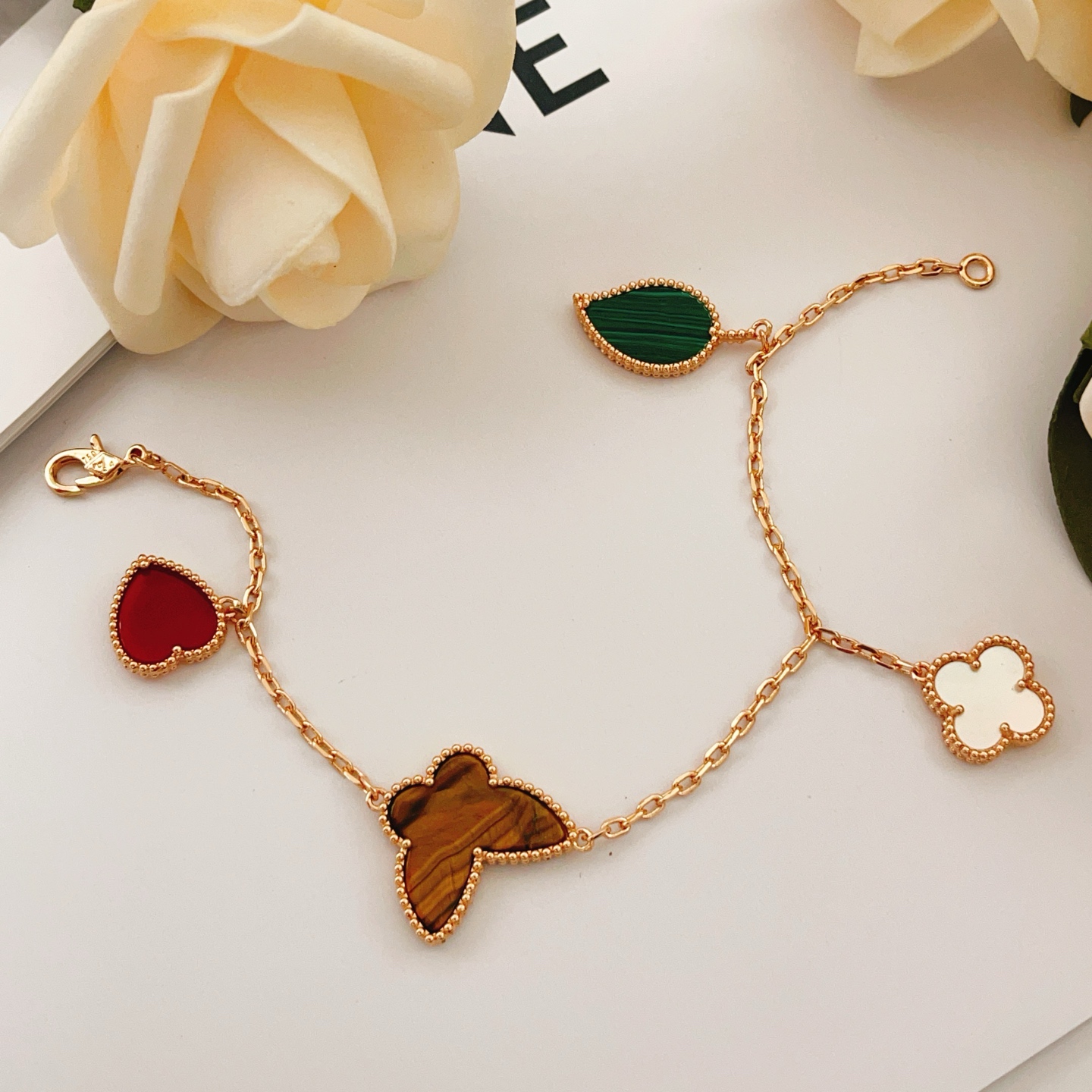 Van Cleef Arpels Lucky Alhambra bracelet Rose gold with red carnelian green malachite brown tiger s eye white mother-of-pearl 19cm
