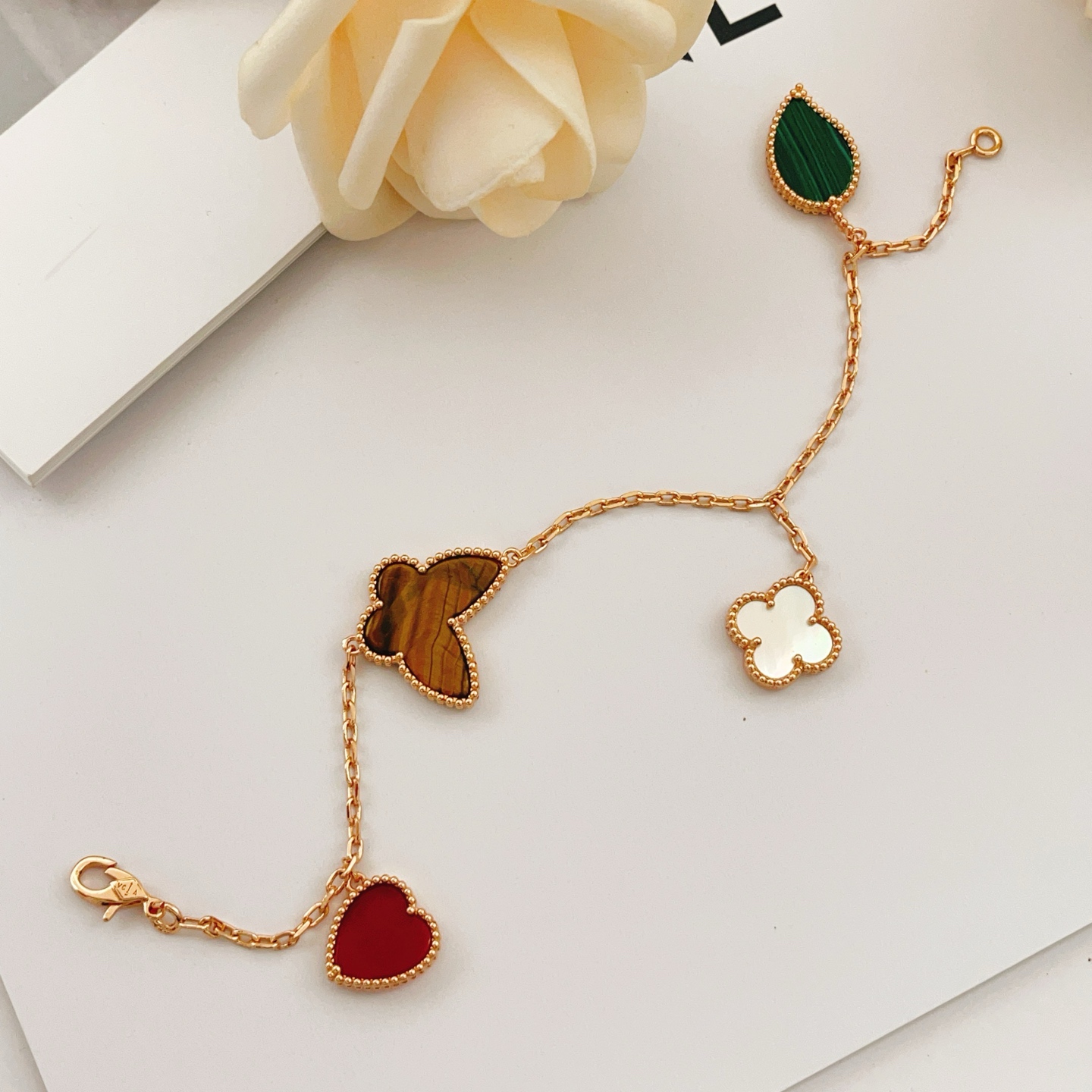 Van Cleef Arpels Lucky Alhambra bracelet Rose gold with red carnelian green malachite brown tiger s eye white mother-of-pearl 19cm