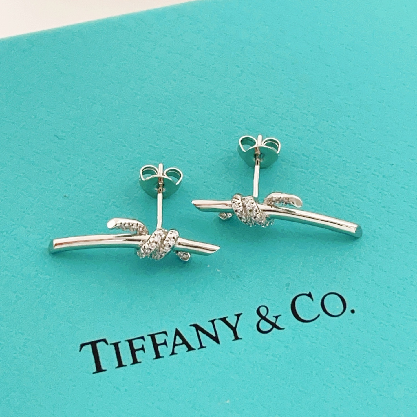 Tiffany Co Knot earrings sterling silver with clear diamond accents 12mm width