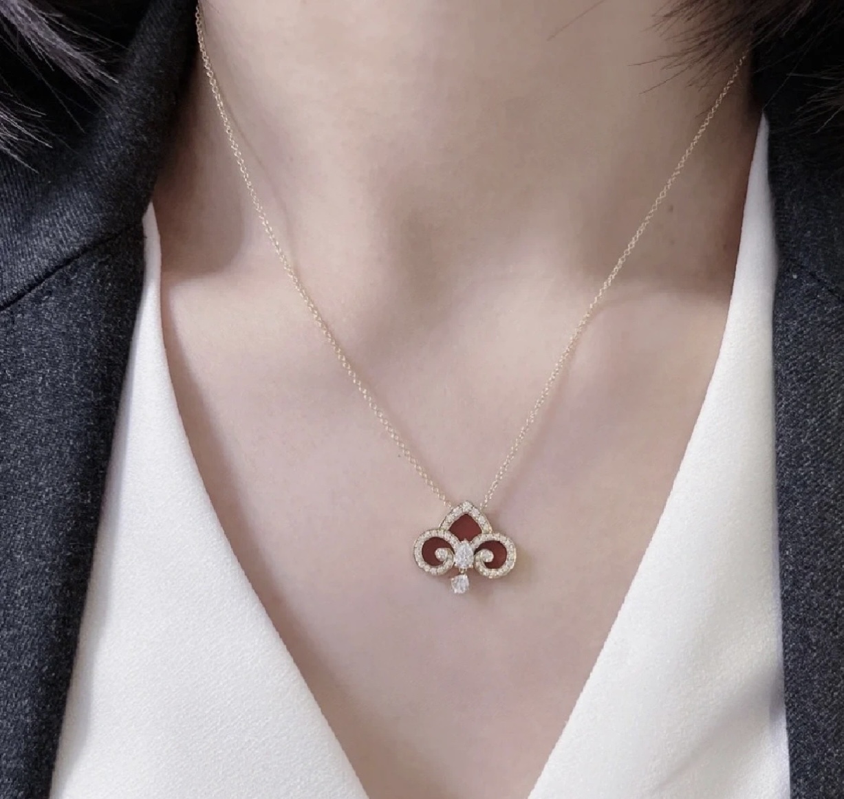 Tiffany Co Fleur de Lis Key Pendant Necklace necklace Rose gold metal with red carnelian inlay and clear diamond accents 45cm