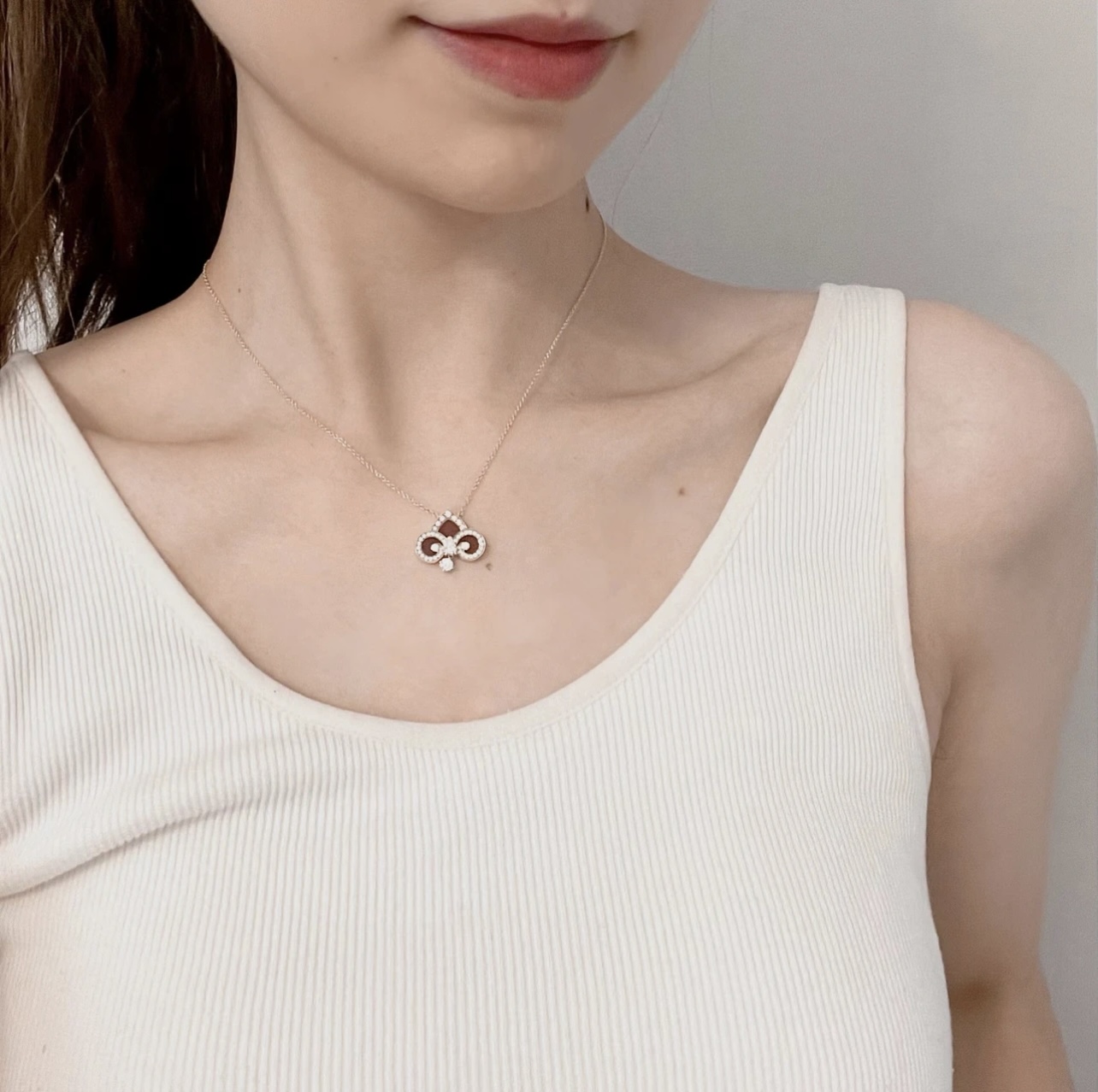 Tiffany Co Fleur de Lis Key Pendant Necklace necklace Rose gold metal with red carnelian inlay and clear diamond accents 45cm