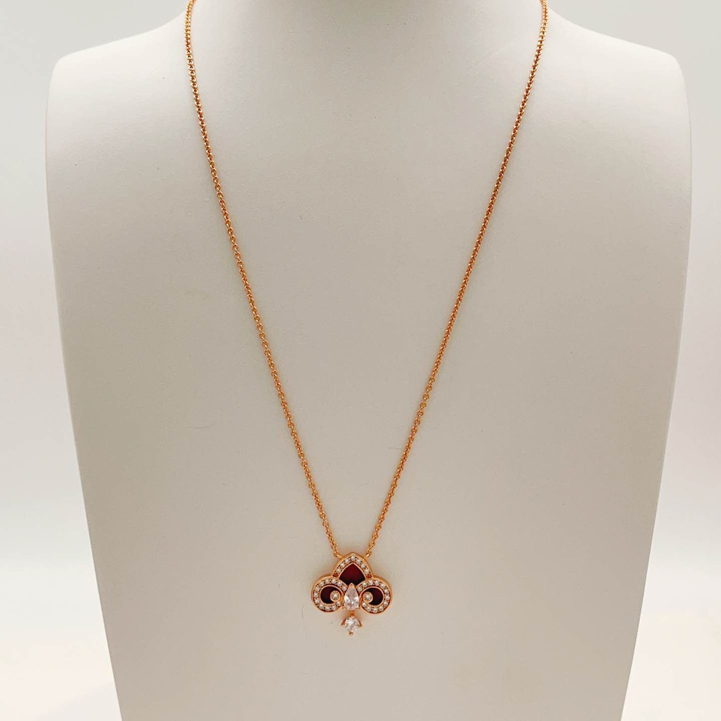 Tiffany Co Fleur de Lis Key Pendant Necklace necklace Rose gold metal with red carnelian inlay and clear diamond accents 45cm