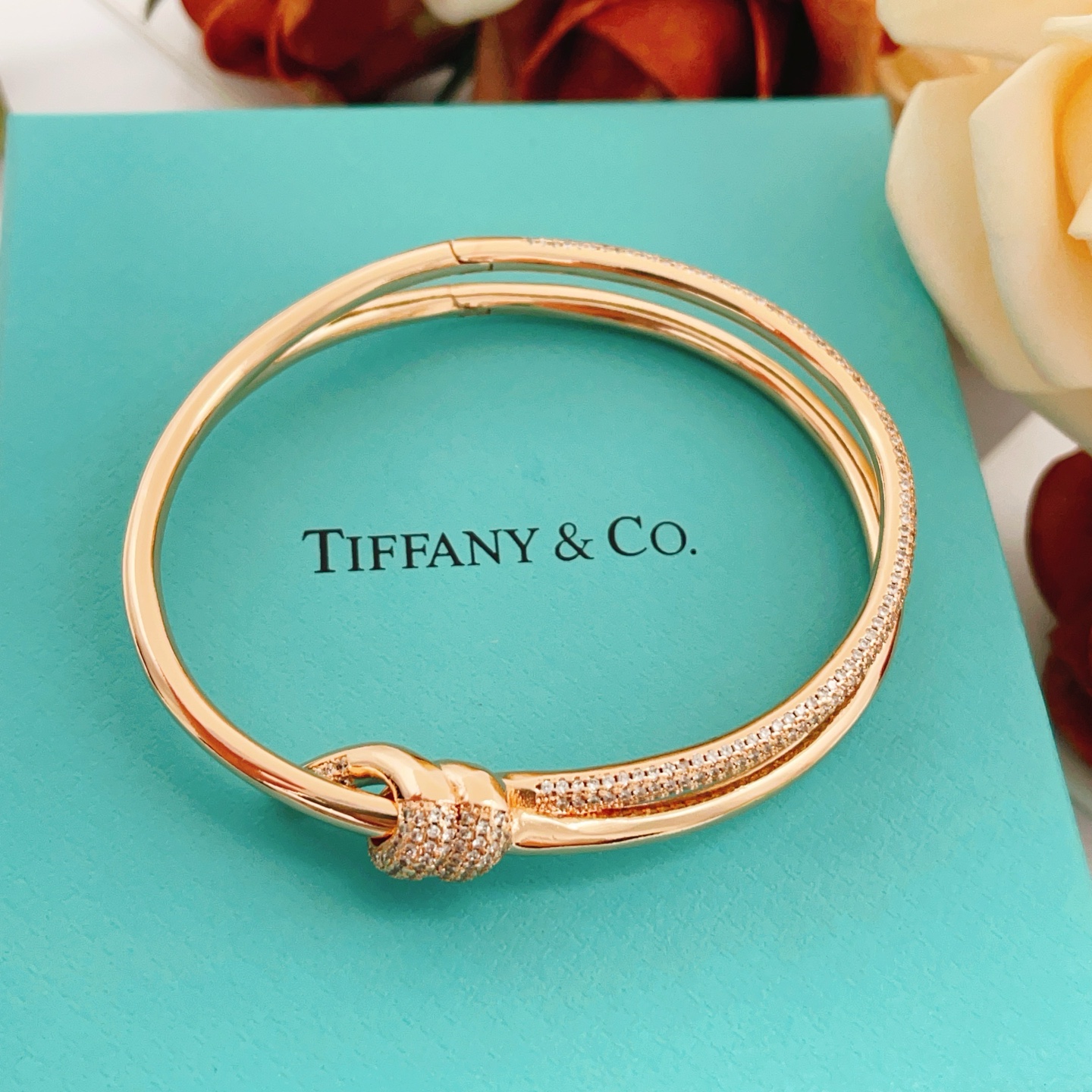 Tiffany Co Knot bracelet rose gold metal with clear pave diamonds 17cm inner circumference