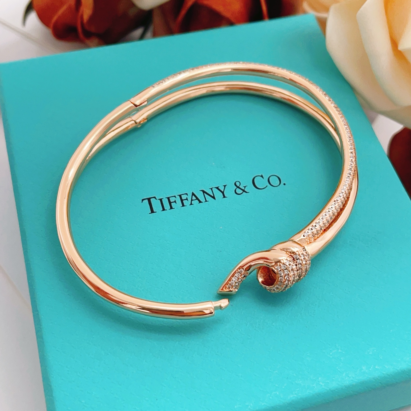 Tiffany Co Knot bracelet rose gold metal with clear pave diamonds 17cm inner circumference