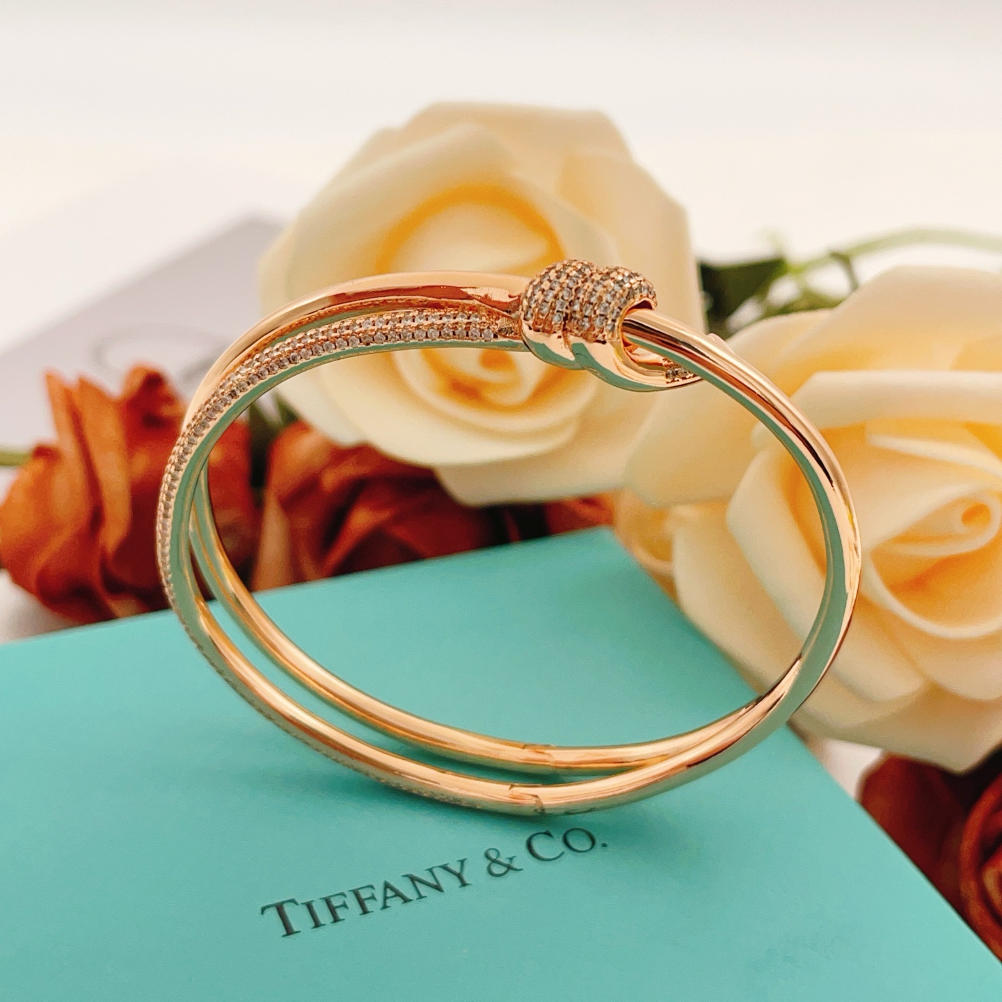 Tiffany Co Knot bracelet rose gold metal with clear pave diamonds 17cm inner circumference