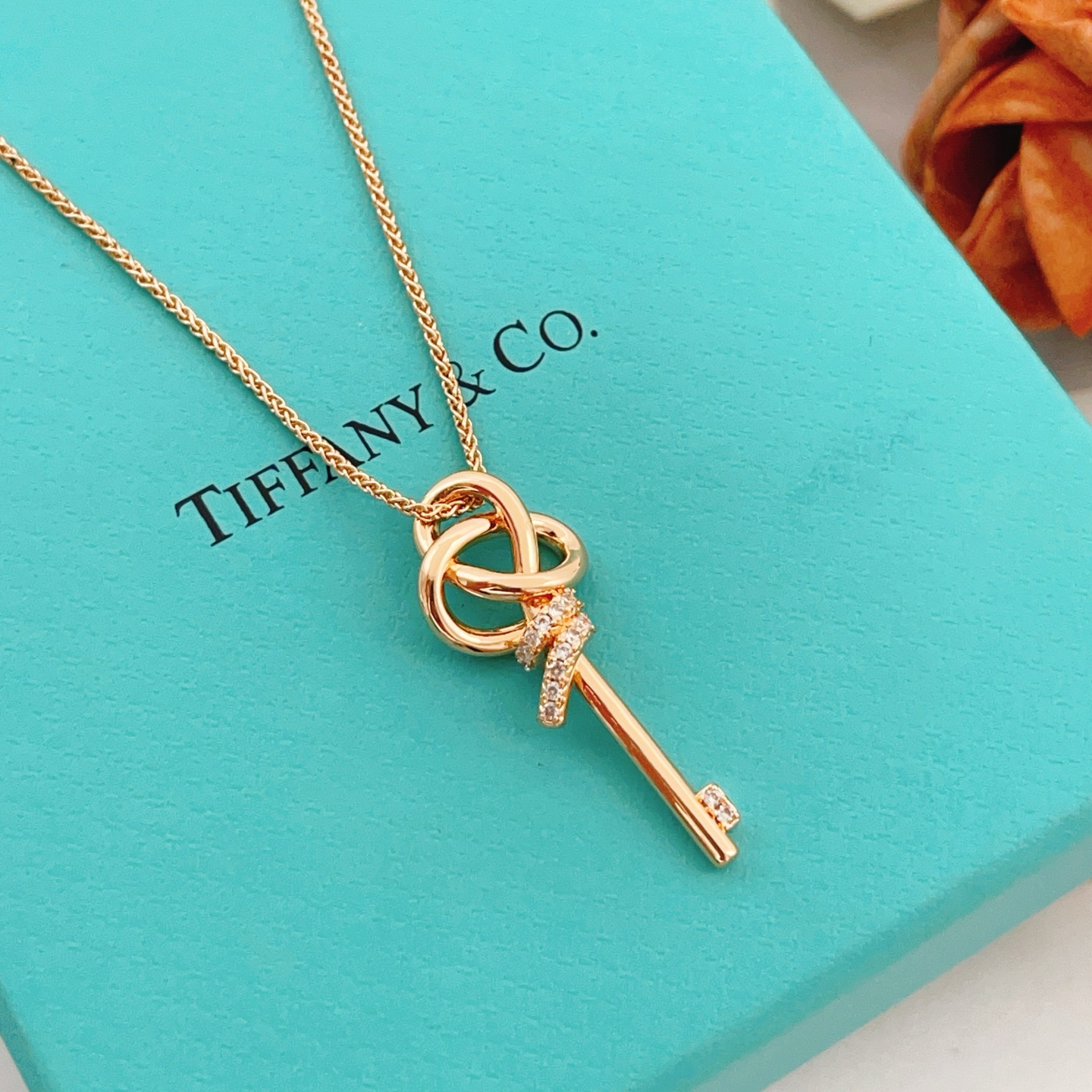 Tiffany Co Tiffany Keys Woven Key Pendant necklace 18k rose gold with clear diamond accents 18 inch chain