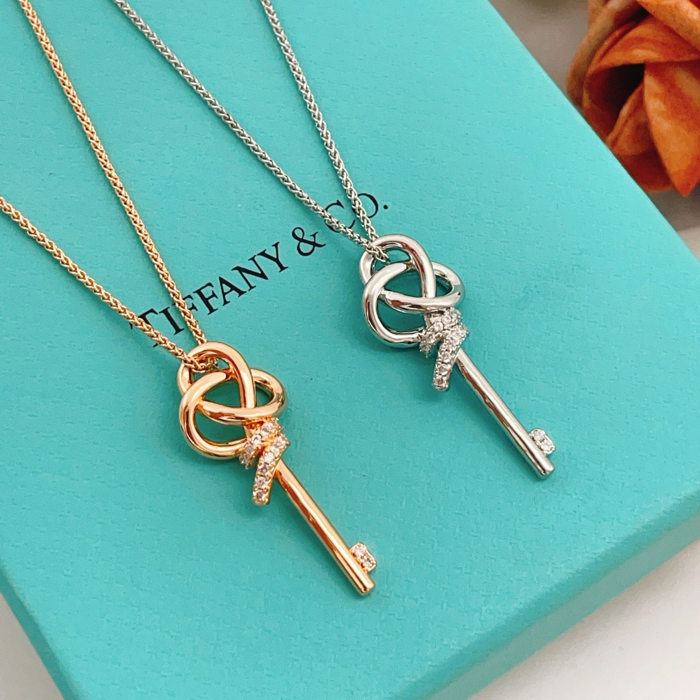Tiffany Co Tiffany Keys Woven Key Pendant necklace 18k rose gold with clear diamond accents 18 inch chain