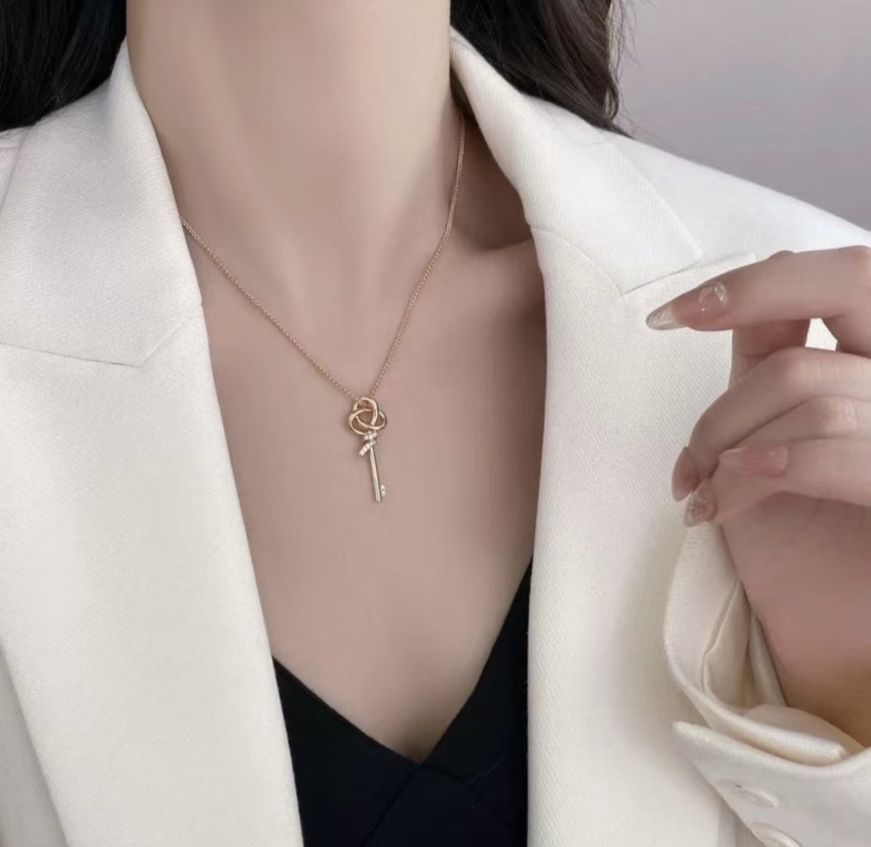 Tiffany Co Tiffany Keys Woven Key Pendant necklace 18k rose gold with clear diamond accents 18 inch chain