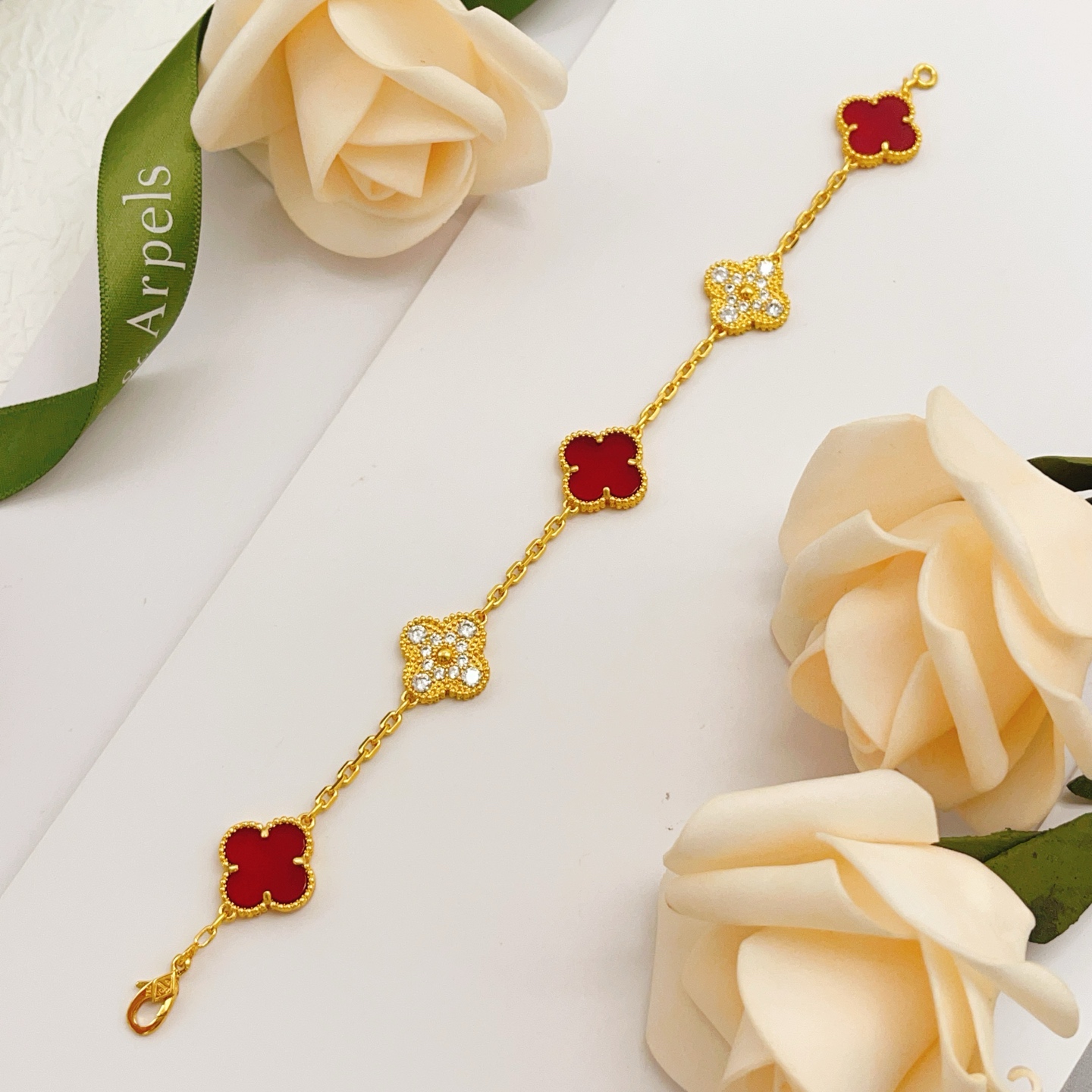 Van Cleef Arpels Vintage Alhambra bracelet Yellow gold with red carnelian and clear diamond accents 18cm