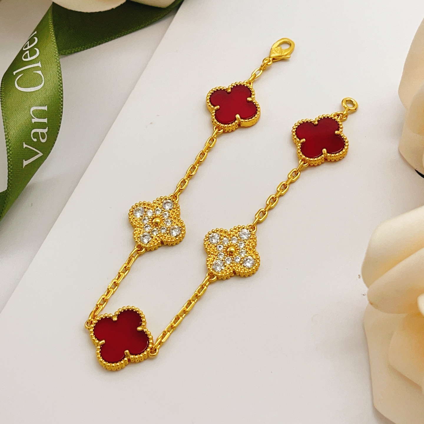 Van Cleef Arpels Vintage Alhambra bracelet Yellow gold with red carnelian and clear diamond accents 18cm