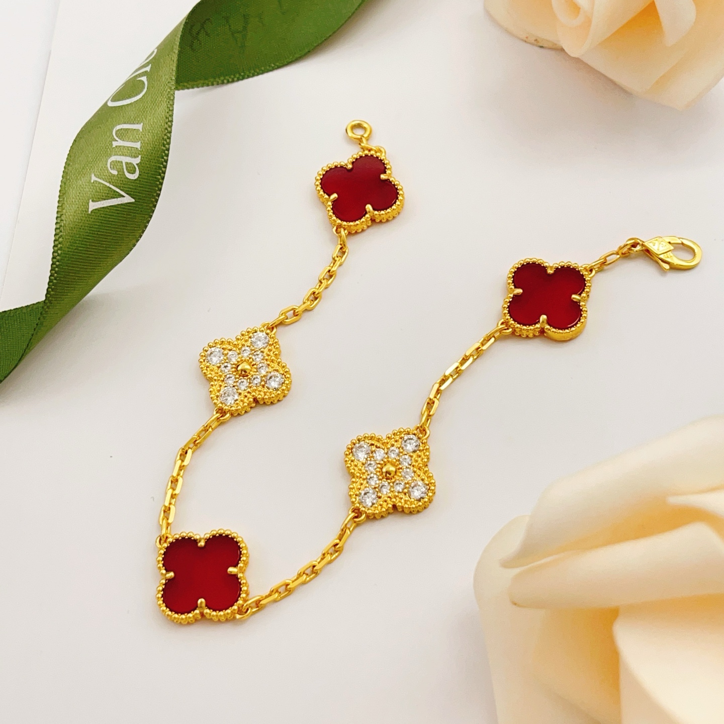 Van Cleef Arpels Vintage Alhambra bracelet Yellow gold with red carnelian and clear diamond accents 18cm