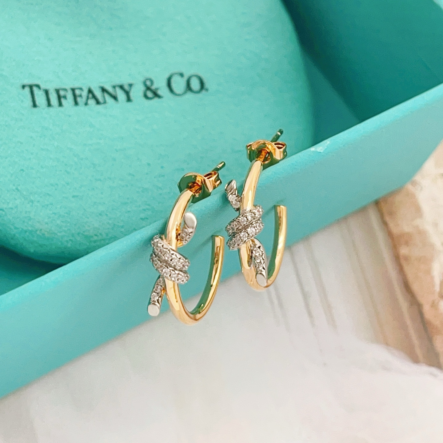 Tiffany Co Knot earrings 18k yellow gold with pave diamond accents 15mm hoop diameter