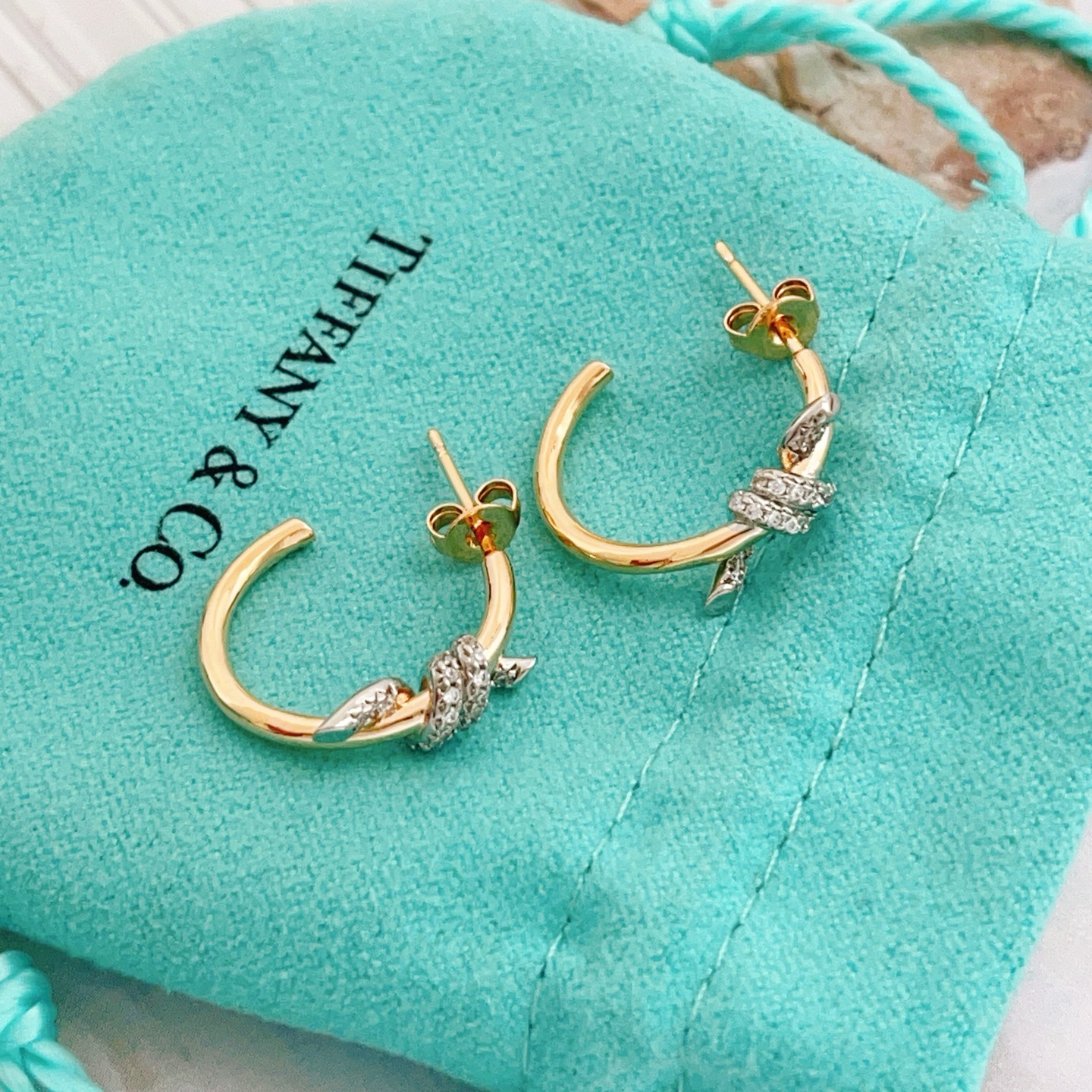 Tiffany Co Knot earrings 18k yellow gold with pave diamond accents 15mm hoop diameter