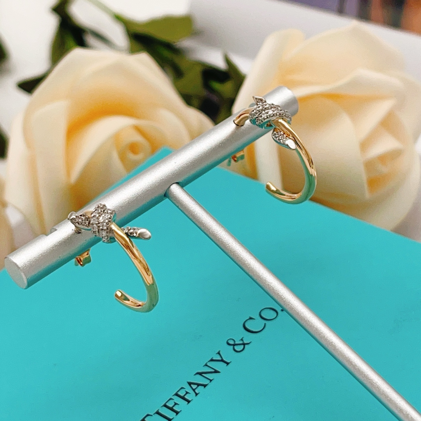 Tiffany Co Knot earrings 18k yellow gold with pave diamond accents 15mm hoop diameter