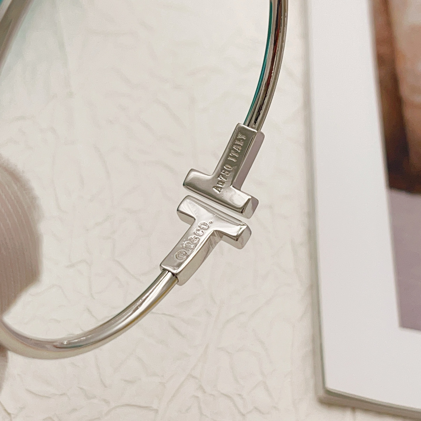 Tiffany Co T Wire bracelet sterling silver with clear diamond accents also available in 18k yellow gold and 18k rose gold with clear diamond accents 17cm inner circumference