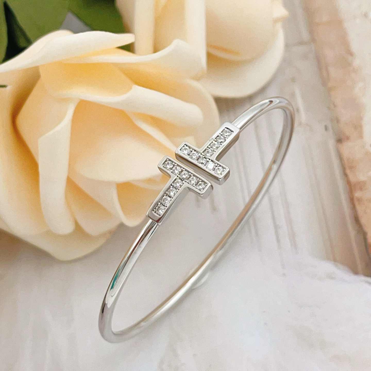 Tiffany Co T Wire bracelet sterling silver with clear diamond accents also available in 18k yellow gold and 18k rose gold with clear diamond accents 17cm inner circumference
