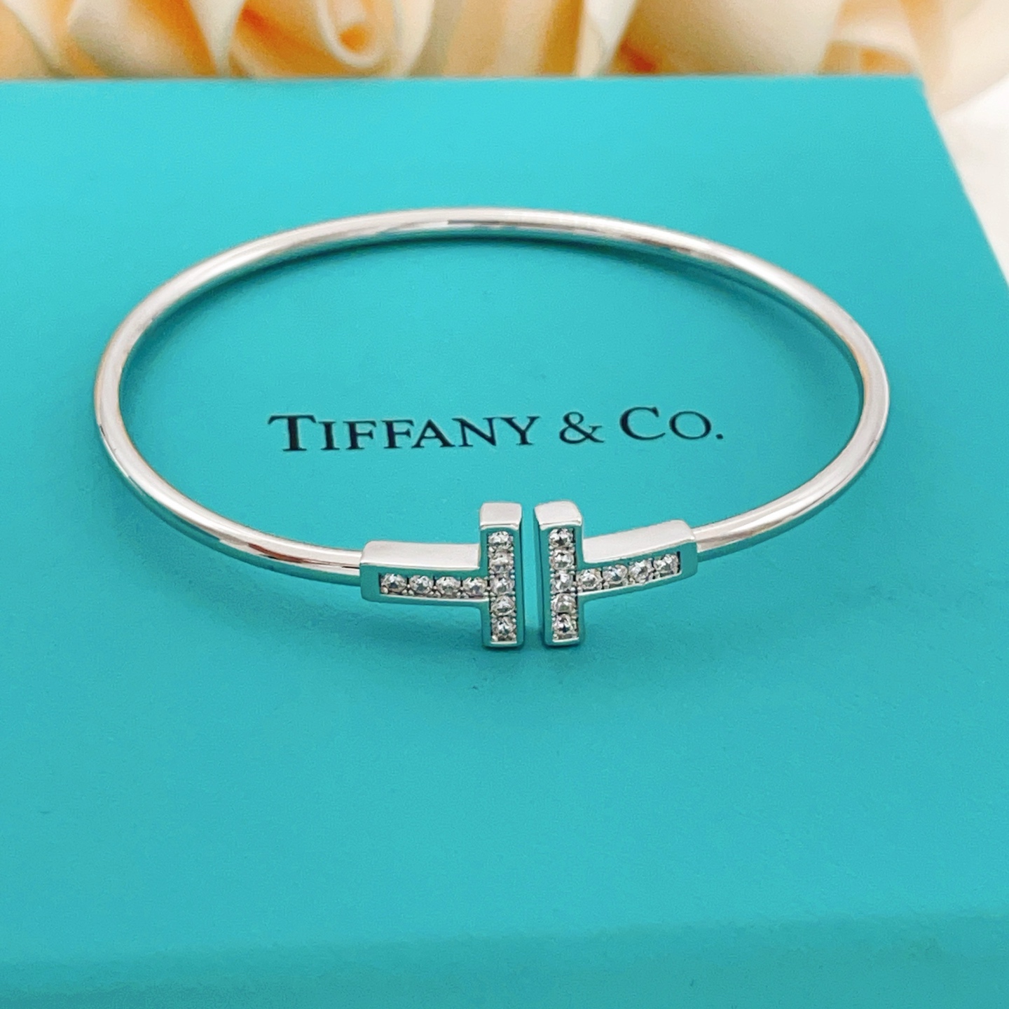 Tiffany Co T Wire bracelet sterling silver with clear diamond accents also available in 18k yellow gold and 18k rose gold with clear diamond accents 17cm inner circumference