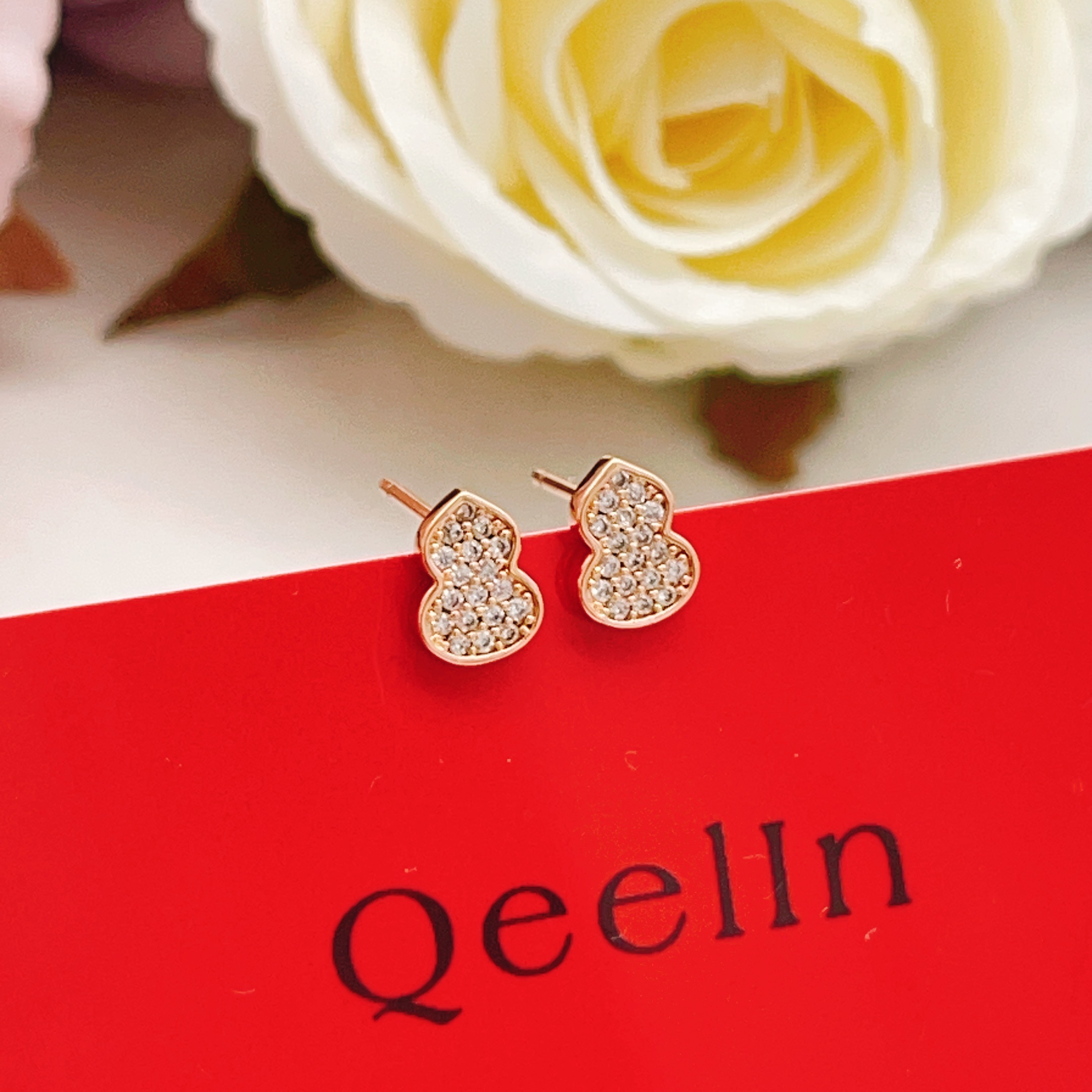 Qeelin Wulu earrings 18K rose gold with pave set clear diamonds 6 5mm stud length