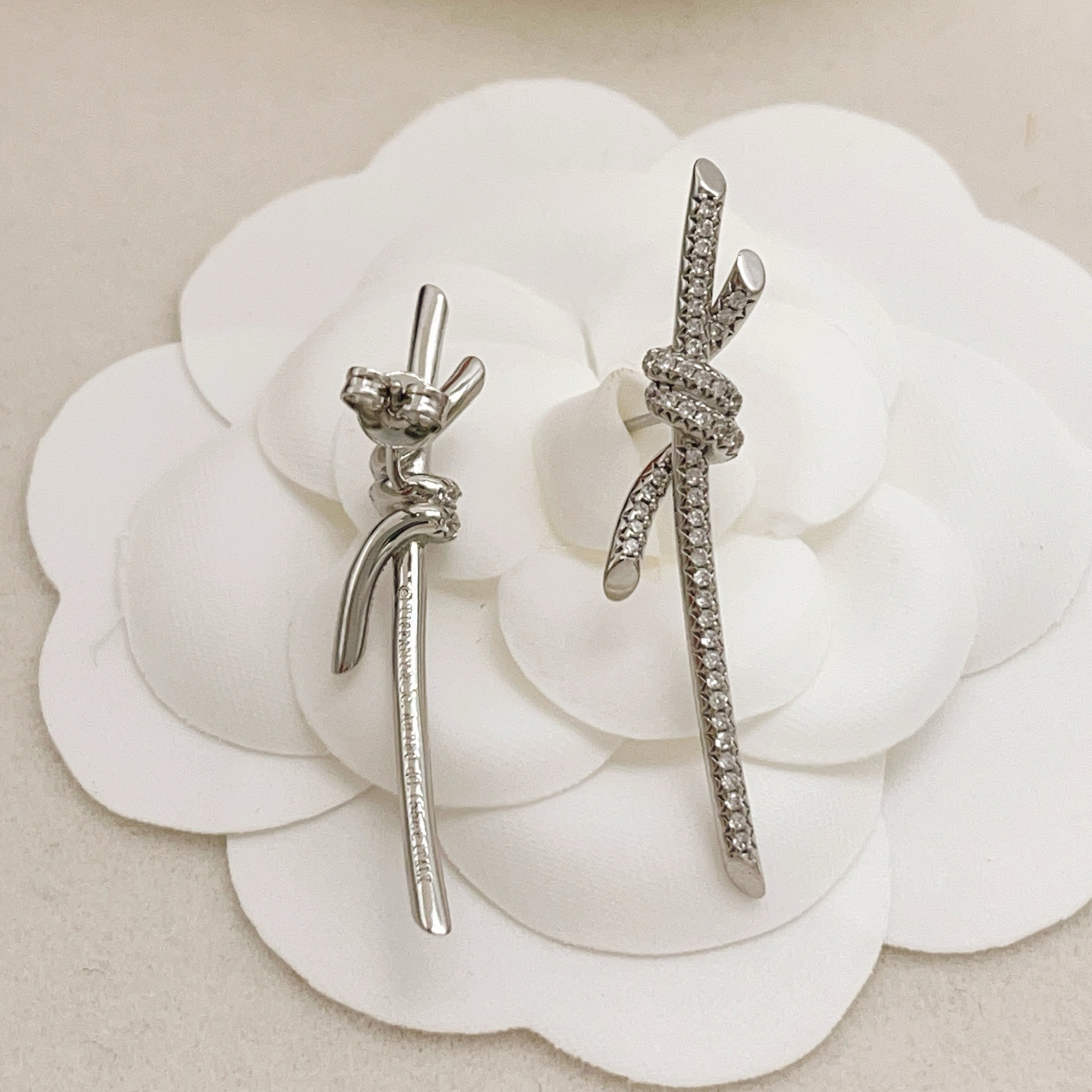 Tiffany Knot earrings silver-toned metal with clear pave diamonds 3 5cm drop length