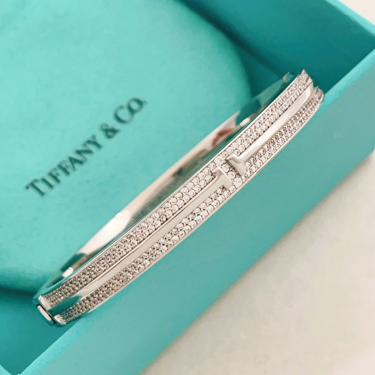 Tiffany Co T Two bracelet silver-toned metal with clear pave diamonds 17cm inner circumference