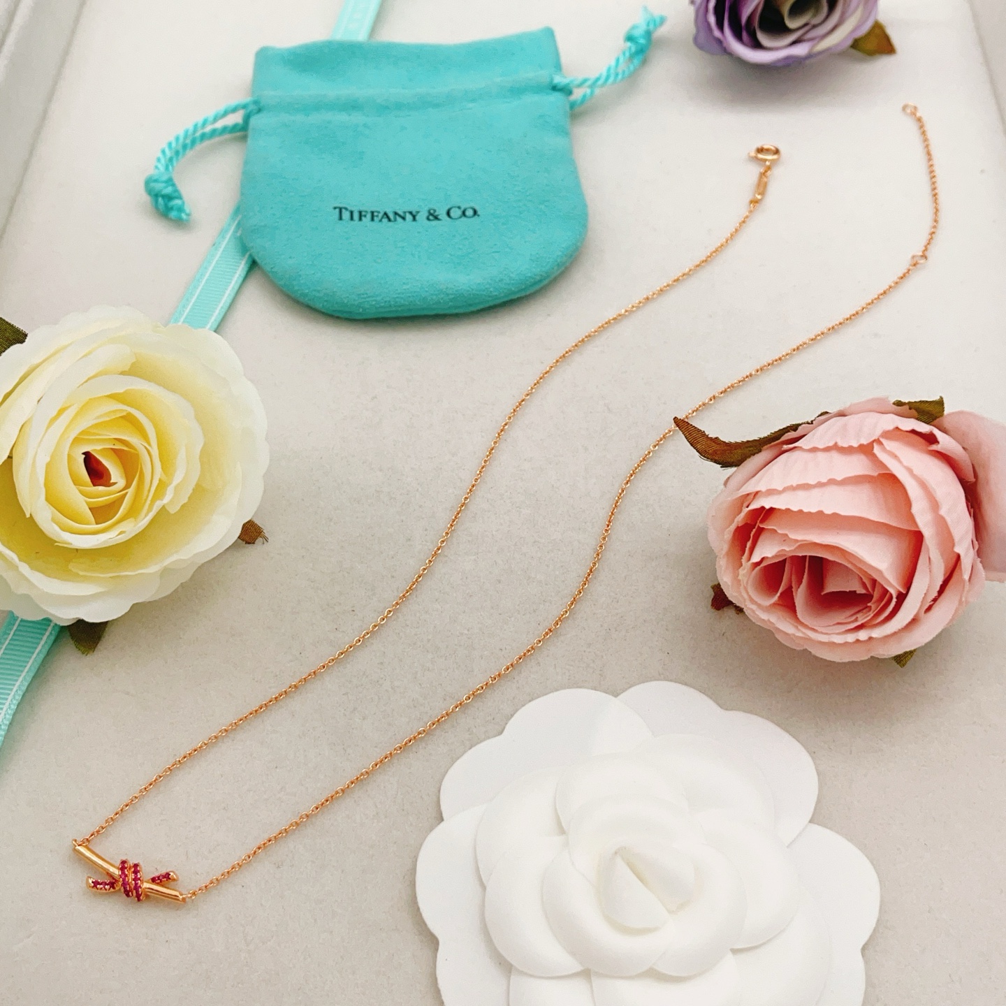 Tiffany Co Knot necklace 18k rose gold with ruby accents 45cm