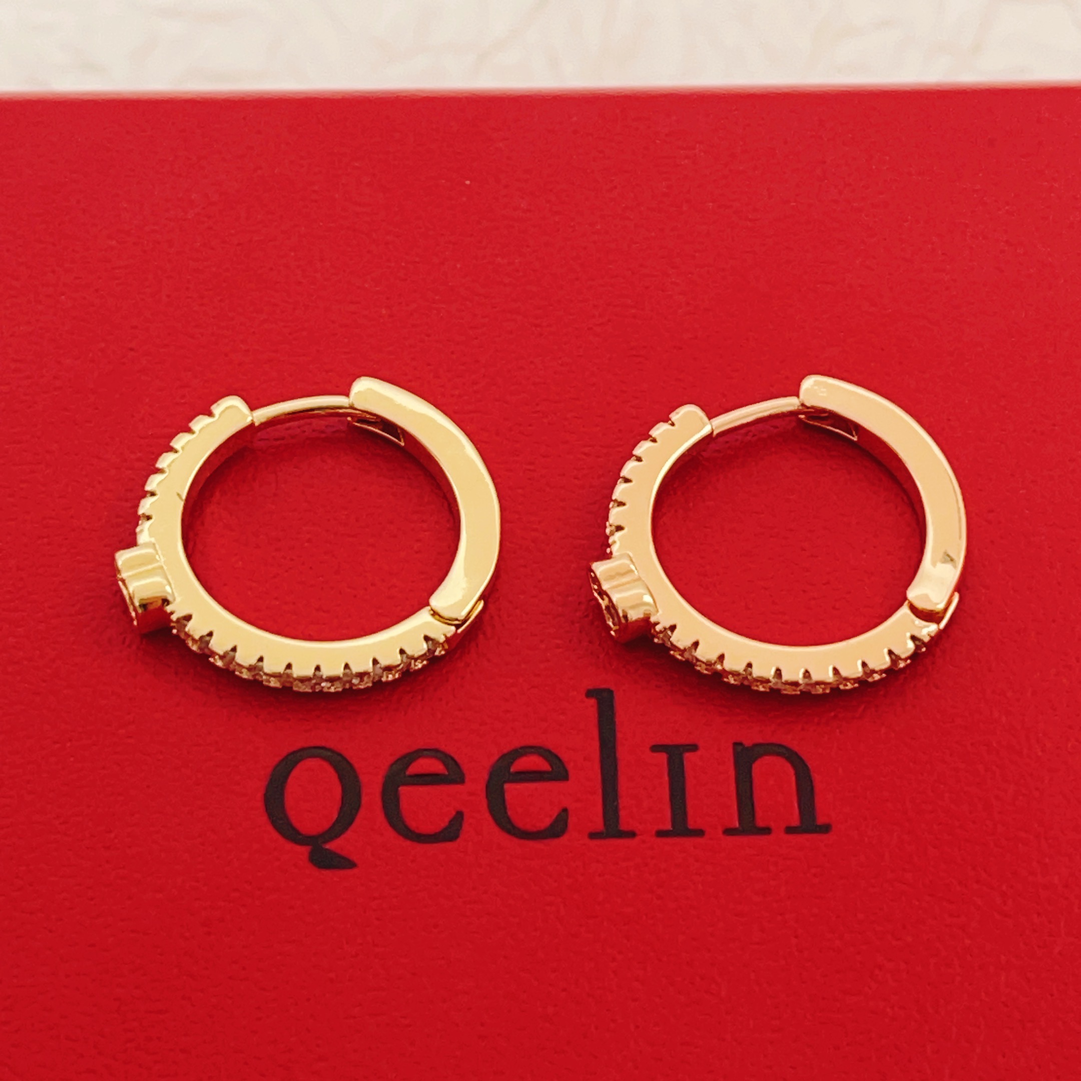 Qeelin Wulu earrings 18K yellow gold with clear diamond accents 15mm hoop diameter