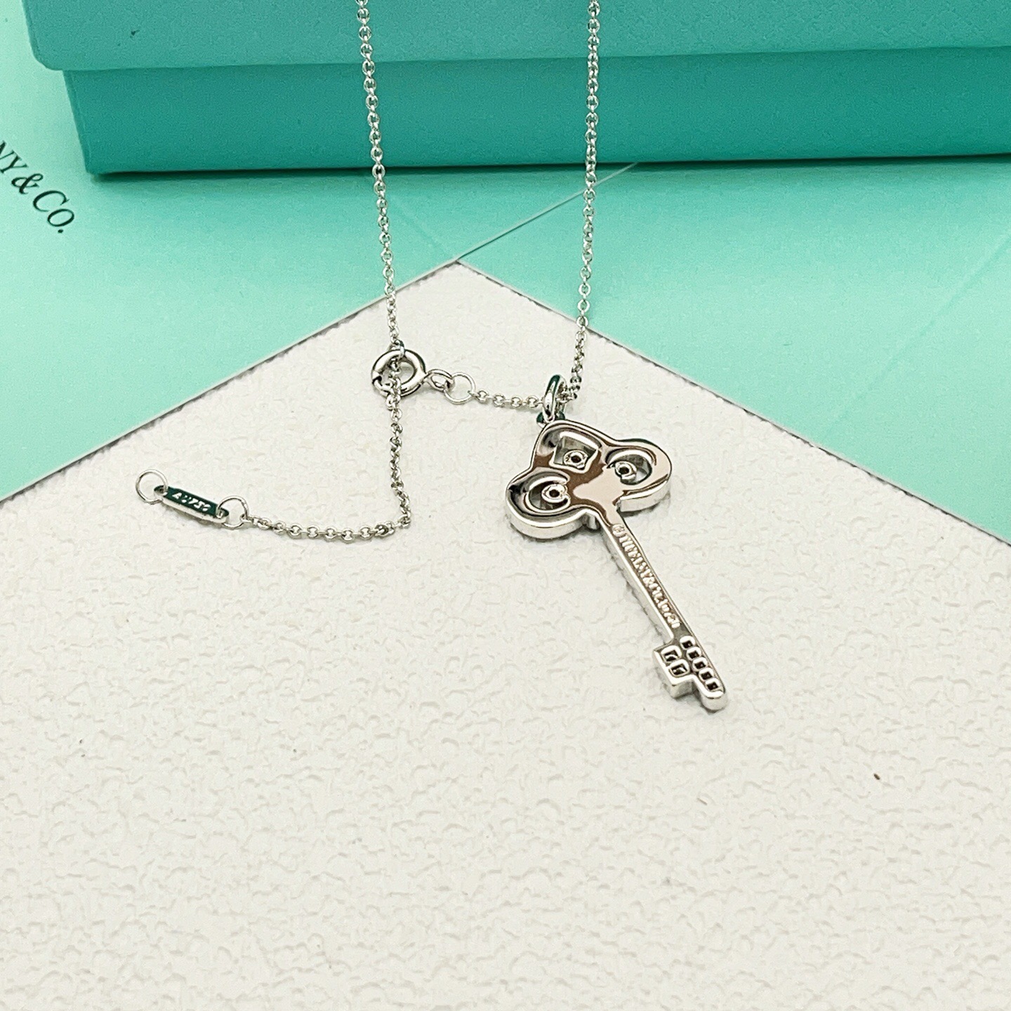 Tiffany Co Tiffany Keys Fleur de Lis Key Pendant necklace 18k white gold with diamond accents 18 inches