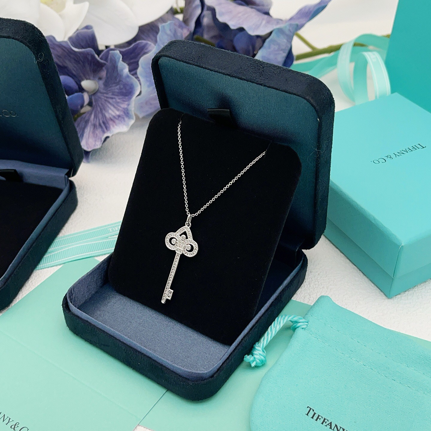 Tiffany Co Tiffany Keys Fleur de Lis Key Pendant necklace 18k white gold with diamond accents 18 inches