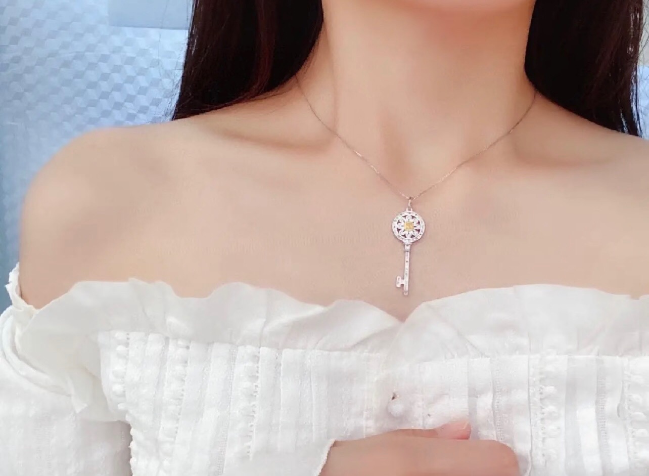 Tiffany Co Tiffany Keys necklace sterling silver with white diamond accents and yellow sapphire center stone 18 inches