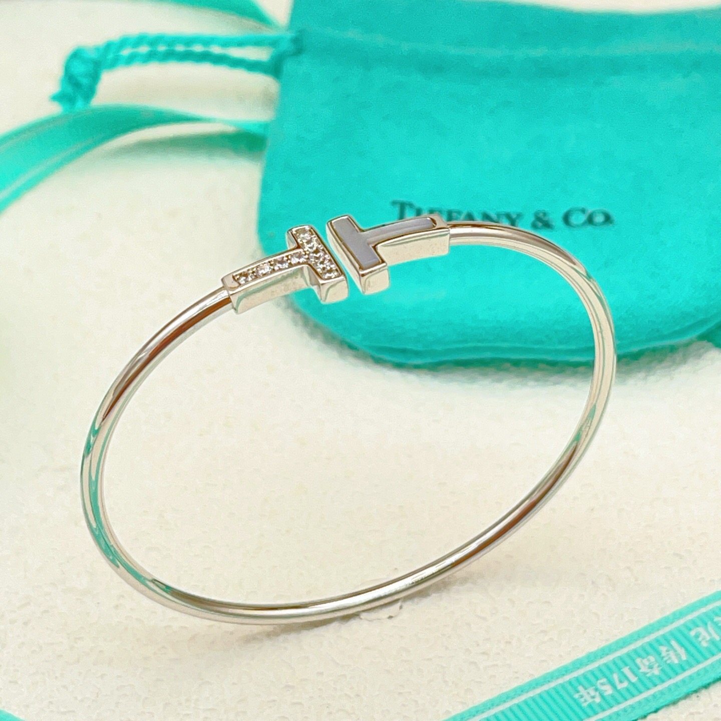 Tiffany Co T Wire bracelet 18k white gold with diamond and mother-of-pearl accents 17cm inner circumference