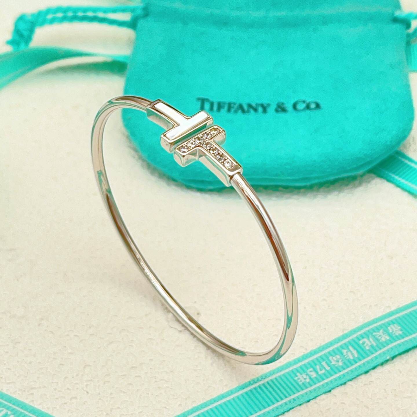 Tiffany Co T Wire bracelet 18k white gold with diamond and mother-of-pearl accents 17cm inner circumference